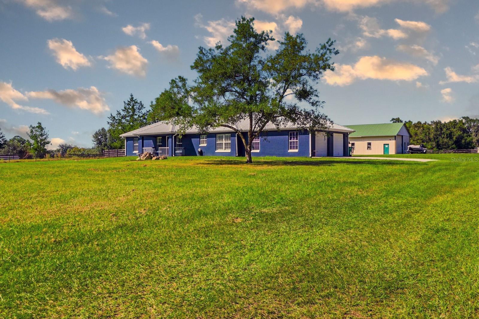 Welcome to Your Country Escape
Nestled in the serene countryside of Summerfield, this charming mini-farm at 5485 14th St offers the perfect balance of rural tranquility and practical amenities. Spread across lush pastures and open sky, it’s an ideal setting for equestrian pursuits, small-scale farming, or simply living your “country home” dream.
Property Highlights
• A generous parcel of land that invites paddocks, pastures, and wide-open vistas.
• Structures designed for farm life — barns, stables or out-buildings ready for livestock, tack rooms or equipment.
• A comfortable residence situated to enjoy views of your land, yet close enough for modern convenience.
• Mature landscaping, peaceful surroundings, and the freedom of A-zoned rural living.
• Convenient access to local amenities while feeling removed from the hustle.• Wake up to the sound of roosters or gentle horses grazing just outside your window.
• Spend your days maintaining pastures, checking on animals, or simply relaxing on a veranda with a view of the sunset.
• With abundant space, you can expand: create vegetable gardens, fruit trees, chicken coops, or even install an arena for riding and training.
• The property offers flexibility: work from home, host family gatherings under the oaks, or build the workshop you’ve always wanted.
Location & Opportunities
Located in the heart of Summerfield’s rural belt, yet within easy reach of nearby towns, shopping and major highways — you’re well-positioned for both lifestyle and convenience. Whether you’re an experienced equestrian, a hobby farmer, or simply seeking more elbow-room and nature’s pace — this mini-farm delivers.  Please see photos and attachments for details on major systems, and improvements/upgrades to the home. Close to The Villages and I-75.  SEE PHOTOS FOR INFO ON MAJOR SYSTEMS, UPGRADES/IMPROVEMENTS