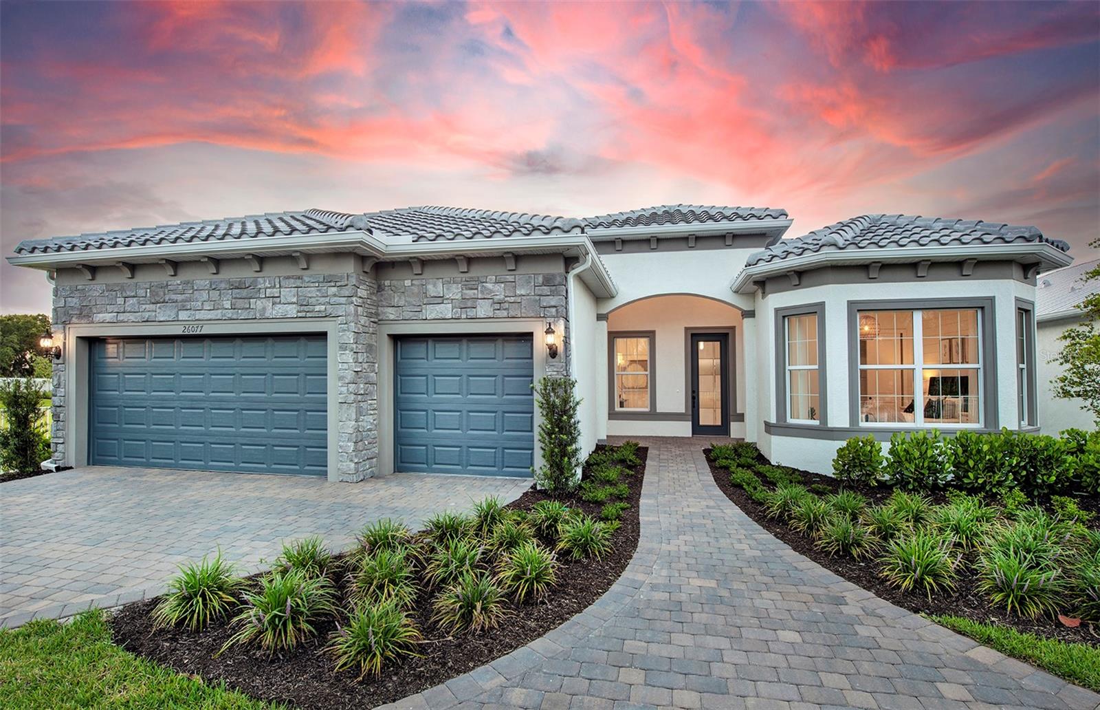 Under Construction. This stunning Stellar floorplan offers 3 bedrooms, 3 bathrooms, a flex room, and a spacious 3 car garage. The beautifully designed home showcases upgraded features throughout, including elegant tile flooring, upgraded cabinetry, quartz countertops, and a luxurious owner's suite with a walk-in shower. Enjoy resort-style living with an incredible array of amenities, including 21 sports courts for pickleball, tennis, and bocce, a resort style pool with beach entry and attached lap pool, a scenic boardwalk with kayak launch, a dog park and miles of walking trails. The gate community features 24-hour guard entry, pool side bar and griller, and a formal dining room opening in 2026.