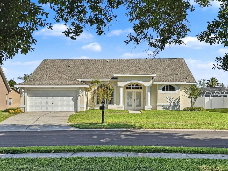 Welcome home to 7839 Roundelay Dr, a well maintained 3/2/2/ pool home offering great curb appeal and a functional layout in the desirable community of Rosewood at River Ridge. From the moment you arrive, you’ll appreciate the inviting exterior, mature landscaping, and evident pride of ownership. Inside, the spacious great room floor plan is enhanced by vaulted ceilings, creating a bright and open atmosphere ideal for both everyday living and entertaining. The split bedroom layout offers added privacy, with a comfortable primary suite featuring a large walk-in closet, dual sinks, and a relaxing garden tub. The kitchen provides ample cabinet and counter space and overlooks the main living area, making it perfect for staying connected while cooking or hosting guests. Step outside to your fully fenced backyard and enjoy the ultimate Florida lifestyle, complete with an outdoor kitchen and a private sparkling pool. The covered patio offers additional space for outdoor dining or lounging, making this home ideal for entertaining year round. Additional highlights include an oversized 2-car garage, indoor laundry, and a layout designed for both comfort and functionality. Located in a community with low HOA fees and no CDD fees, this home delivers excellent value while keeping monthly costs manageable. Conveniently situated 5 mins shopping, dining, schools, and major roadways. Important updates include a 2019 roof, and a 2016 HVAC system (per permits). Settlement repair currently in progress (to be completed prior to closing), pool will also have a brand new paver deck. Don’t miss this opportunity to own a solid, well-cared-for pool home with great features and long-term value!