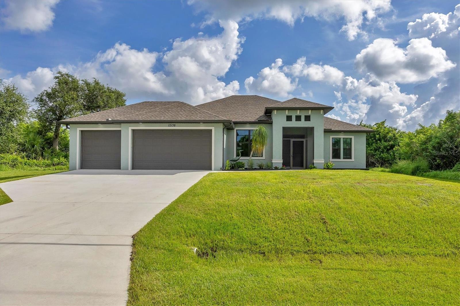 Pristine 3 Car Garage Pool home located on the border of East Englewood's 34224 zip code! IMPACT Windows & Shutters to cover doors and pocket sliders. NO flood damage - X Flood Zone! Breakwater Construction Islamorada Model custom built home was completed at the end of 2021. Impeccably maintained and upgraded by the owners. Love outdoor living in Paradise? The oversized screened pool cage runs the entire back of the home providing plenty of seating, an outdoor shower and grilling space. The upscale salt water pool has a built in sun shelf for relaxing or a great space for the children or family dog to splash around. The backyard is enclosed with a black vinyl fence. This home has an inviting wow factor as soon as you pull into the extra wide driveway. You are greeted with an oversized front screen entrance with tall double doors. As you enter the home, your view out the pocket sliders goes directly to the pool! Split bedroom floor plan with the primary suite off the right side of the home. Large walk-in closets, pocket sliders overlooking the pool, dual bath vanities with granite countertops and roman shower. The guest wing can be closed off with the pocket door for more privacy and has a guest bath which also serves as a convenient pool bath. Cooking and entertaining comes easy in this beautiful kitchen with granite countertops, breakfast bar / island, huge pantry, shaker cabinets and slate appliances. Short drive to the Englewood Beach or fishing capital on Boca Grande. Plenty of public golf courses, pickle ball courts and boat ramps. Live entertainment, Tiki bars, and fine dining throughout the area. Call for your private showing!
