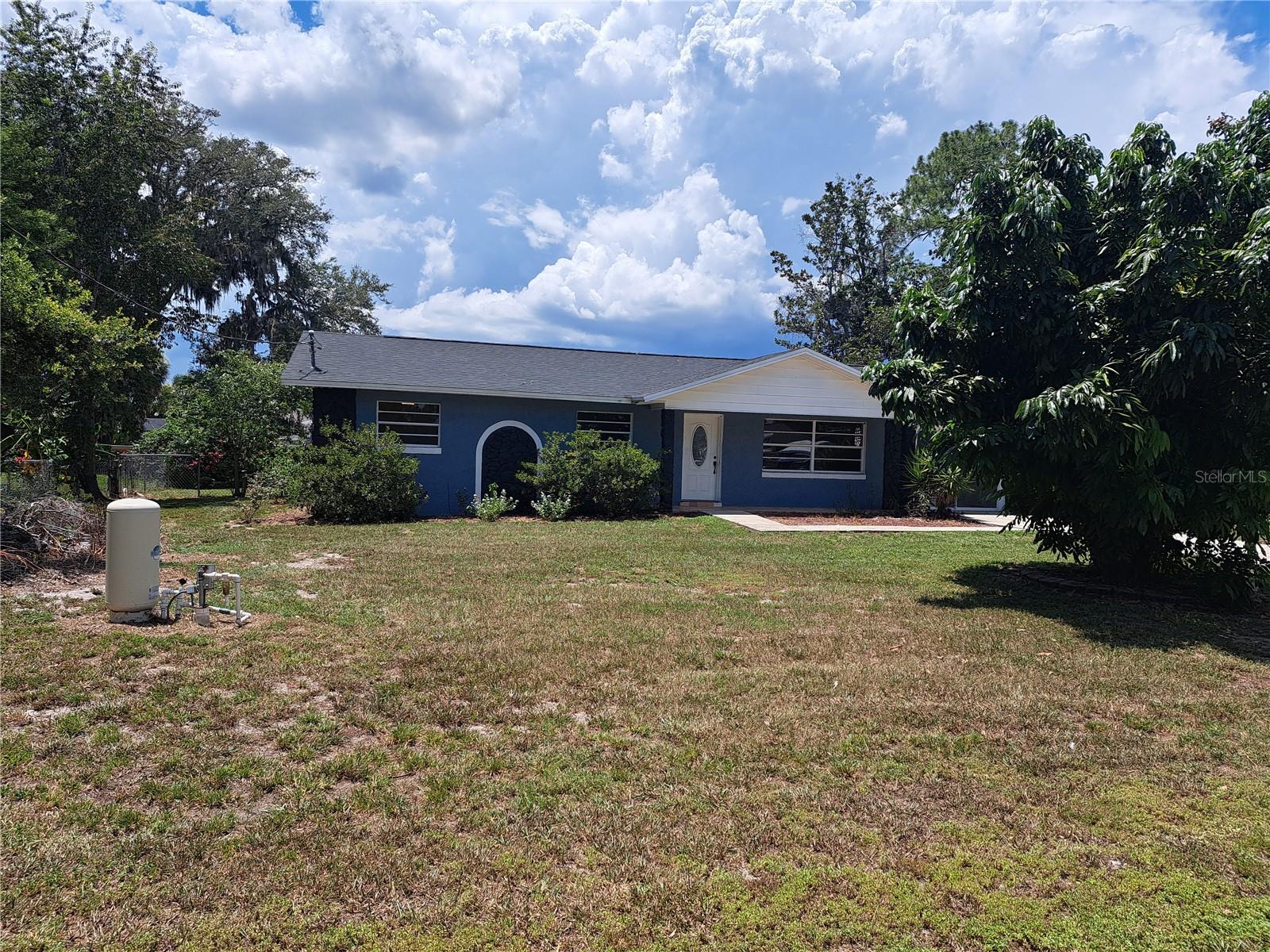 LONG-TERM, ANNUAL LEASE....Charming 3 Bedroom, 2 Bath Pool Home on 0.33 Acres – Just Minutes from The Villages! Welcome to 5672 CR 173, a beautifully updated home featuring 3 spacious bedrooms, 2 remodeled bathrooms, and a generous open floor plan perfect for modern living. Nestled on a third of an acre in a quiet neighborhood just outside The Villages, this property offers both privacy and convenience. Enjoy Florida living at its finest with a screened-in, in-ground swimming pool, a large fenced backyard, and an expansive screened lanai – perfect for relaxing or entertaining year-round. The recently remodeled kitchen boasts stainless steel appliances, stylish cabinetry, and updated finishes, while the renovated bathrooms offer comfort and a touch of luxury. The primary suite includes a walk-in shower. Need extra room? The garage has been converted into a spacious bonus room – ideal for a home office, playroom, gym, or guest space. Don't miss your opportunity to rent this move-in-ready gem in a peaceful setting with no HOA, yet close to all the shopping and dining of The Villages. LAWN CARE AND POOL MAINTENANCE INCLUDED IN RENT!