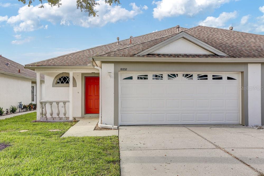 One or more photo(s) has been virtually staged. Bright, Beautiful & Ready for You in Oakstead! Welcome to 19332 Everton Place — a charming, super clean 3-bedroom, 2-bath home in the heart of the popular Oakstead community in Land O’ Lakes. This one’s not just move-in ready — it’s move-in happy. From the moment you walk in, you’ll notice how well-loved and meticulously maintained this home truly is. Fresh interior paint gives everything a crisp, clean feel, and the newer appliances — including the washer, dryer, fridge, microwave, and dishwasher — mean there’s nothing left to do but unpack and enjoy. Every room features modern, remote-controlled ceiling fans, and with tile floors throughout, you won’t find a stitch of carpet (your allergies and your vacuum will thank you).The kitchen is roomy and bright, with space for a breakfast table and a great flow into the open living area — perfect for entertaining or cozy nights in. The primary suite features dual sinks and a walk-in shower, giving you a little retreat of your own.
Step outside to a screened lanai that’s just right for morning coffee or relaxing in the evening. The two-car garage gives you plenty of room for your vehicles and anything else you need to stash away. Tucked on a quiet cul-de-sac, this home offers added peace and privacy — and since the HOA handles the lawn care, your yard will always look picture-perfect without the sweat.
This is more than a house — it’s a fresh start in a fantastic neighborhood. Come see why this gem won’t last long!