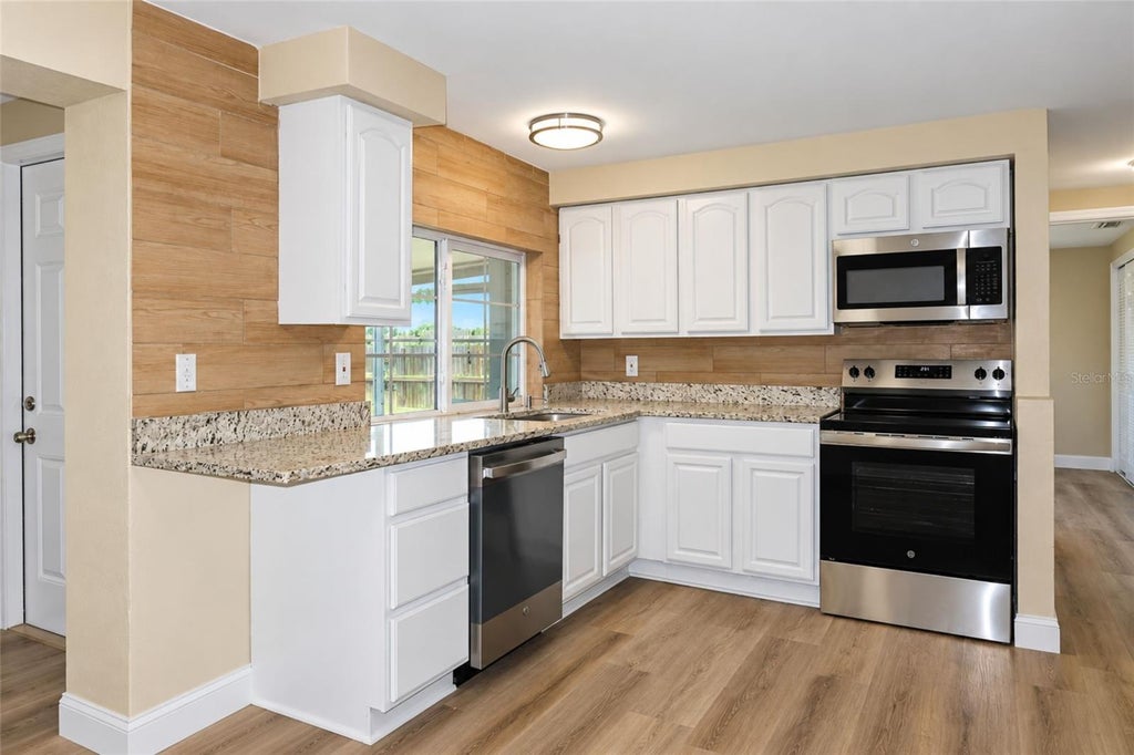 Photo of 3521 Kimberly Oaks Drive, Holiday, FL 34691 (MLS # TB8552753)