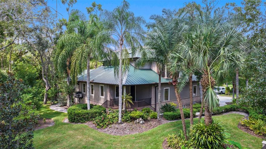 Build Your Dream Home on 5.7 Acres Overlooking a Pond—Complete with Guest House, 3-Bay Workshop & More! Endless opportunities await on this scenic 5.7-acre property. Whether you’re ready to create your custom estate or enjoy the thoughtfully designed guest house, this property offers comfort, flexibility, and room to grow. The guest house, built with solid poured concrete reinforced with steel and rebar, is exceptionally well-constructed and designed for both style and function. On the main level, you’ll find a spacious office with custom built-in cabinetry, a bedroom, and 2 sitting areas—one with a Murphy bed that can easily convert into a private suite with its own kitchenette and private entrance. Plantation shutters add timeless elegance, while a bright sitting room opens to beautifully landscaped grounds featuring a swim spa, expansive deck, and an outdoor kitchen. The custom Blaze grill with smoker is set within a built-in enclosure complete with a protective metal door—perfect for entertaining in any season. The second level of the guest house feels like a private residence of its own, complete with a full kitchen, living room, dining space, private balcony, a generously sized bedroom with two walk-in closets, and a full bathroom. Huge garage on the house with a kitchen area complete with a dishwasher located on an upper level of the garage and right by the grilling area! Car enthusiasts, light industrial work, and hobbyists will love the huge metal 3-bay workshop with its own bathroom. This versatile building is ideal for storing cars, RVs, boats, or lawn/large equipment, and also includes an upper-level storage loft that could double as an office. An additional covered side bay provides even more space for equipment. With 5.7 acres of open land and a serene pond backdrop, there’s plenty of room for equestrian use, gardens, or building your dream residence. This property offers the perfect blend of function, leisure, and future potential. The metal roof on guest house was replaced in 2022!