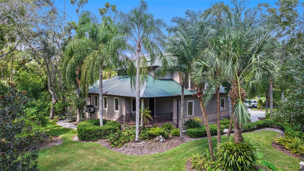 Photo of 1252 E Lake Drive, Tarpon Springs, FL 34688 (MLS # TB8431734)