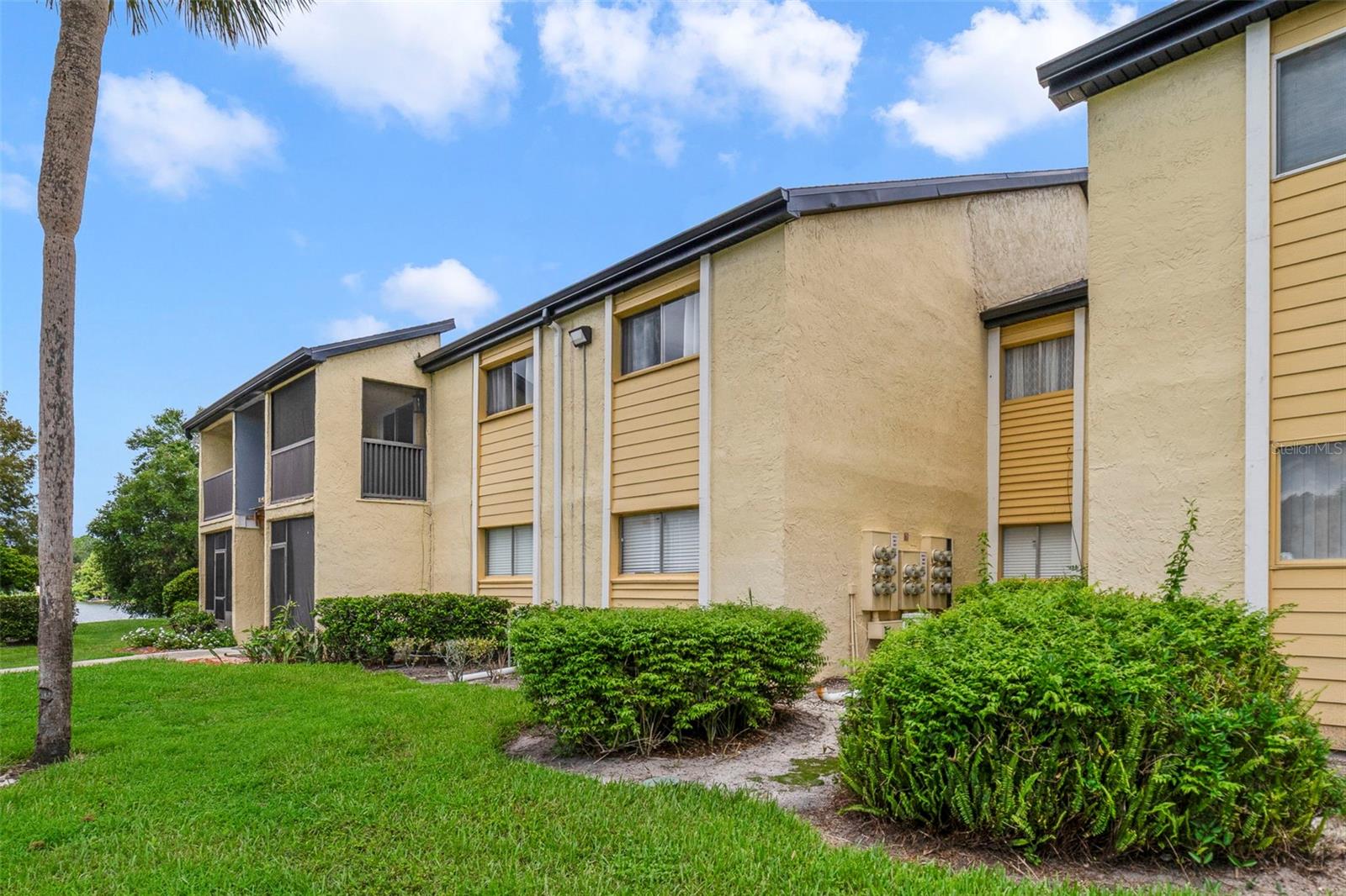 Enjoy peace of mind and endless comfort in this spacious second floor unit in the beautiful Destiny Springs community of Altamonte Springs! Major UPDATES have already been completed; including a NEW ROOF (2024), UPDATED A/C (2022), and a RE-PIPE (2021). The water heater has also been updated, giving you added confidence to move right in. Located on the far side of the community where you will enjoy less traffic, this 3-bedroom, 2-full bath condo overlooks ONE of THREE COMMUNITY POOLS and offers a spacious, flowing layout designed for everyday living. Easy care TILE FLOORS flow throughout the home delivering both style and practicality. The light and bright living room features a chic ELECTRIC FIREPLACE built into a feature wall and sliding glass doors that open onto a SCREENED BALCONY – an ideal spot to relax with views of the pool. A dedicated dining space with an upgraded modern light fixture flows into the UPDATED KITCHEN where you will find desirable GRANITE COUNTERTOPS, a decorative TILED BACKSPLASH, shaker style cabinetry that features SOFT-CLOSE, and coordinating appliances. The PRIMARY SUITE is a private retreat with DOUBLE CLOSETS and its own en-suite bath. Bedrooms two and three share a second full bath, offering flexibility for family, guests, or a home office. Life at Destiny Springs means more than just a beautiful condo – it is a community experience! Residents enjoy access to three community pools, a clubhouse, tennis courts, a dock, resident-only boat ramp, onsite laundromat, car wash area, and more. With plenty of parking and well maintained grounds, convenience is built right in. The community sits along the shores of Lake Destiny, giving residents the unique benefit of a lakefront lifestyle. Low maintenance living here means you can spend more time enjoying the amenities and less time worrying about upkeep. Beyond the community, you are close to everything – just minutes from I-4, 436, 434, and Maitland Blvd, with a variety of options for shopping and dining. If you have been searching for a well maintained condo with modern updates, great amenities, and a prime Altamonte Springs location, this Destiny Springs home is an ideal choice! Schedule your tour today and let us say, WELCOME HOME!