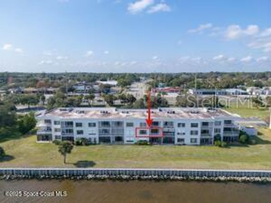 DIRECT River Views and LOW monthly HOA fees for under 200k! Wake up to gorgeous sunrises over the Indian River, watch dolphins play from your private balcony and catch spectacular rocket launches right from the comfort of your home. This condo is ready for your personal touch and features in-unit laundry, new carpet and amazing water views from both the living area and primary bedroom. Association is fully funded and offers two fishing docks, sparkling pool, tennis courts and plenty of green space dotted with mature trees. Prime location too - less than 25 minutes to Cocoa Beach with the Port St. John boat ramp, boat storage facilities, parks, shopping and restaurants nearby. Enjoy a fast and easy commute to major employers like Blue Origin, Space X and Cape Canaveral Space Force Station. Whether you are looking for a weekend getaway, primary residence or 2nd home to escape snowy winters, this condo delivers. Schedule your private showing today and live where others come to vacation!