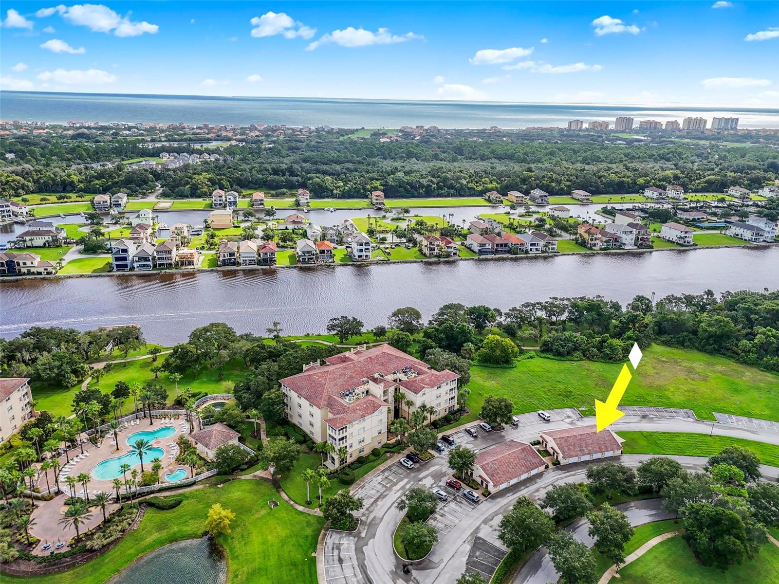Step into luxury coastal living with this beautifully upgraded 2BR/2BA second-floor condo in the prestigious Tidelands on the Intracoastal, complete with a private one-car garage. Every detail has been thoughtfully designed—granite countertops with artisan backsplashes, crown molding, custom closets in every room (including pantry), elegant chandeliers, custom draperies, plantation shutters, and gleaming tile floors throughout. The spacious living area opens to a large balcony with stunning views of the lake, pool, and Intracoastal, while the building’s private location offers added tranquility. Offered furnished with accepted offer, this home is move-in ready. Tidelands is a resort-style community featuring scenic walking trails along the Intracoastal, multiple pools, tennis and pickleball courts, clubhouse, and fitness center. A rare opportunity to own a fully upgraded condo with a garage in one of Palm Coast’s most desirable gated communities—don’t miss it!