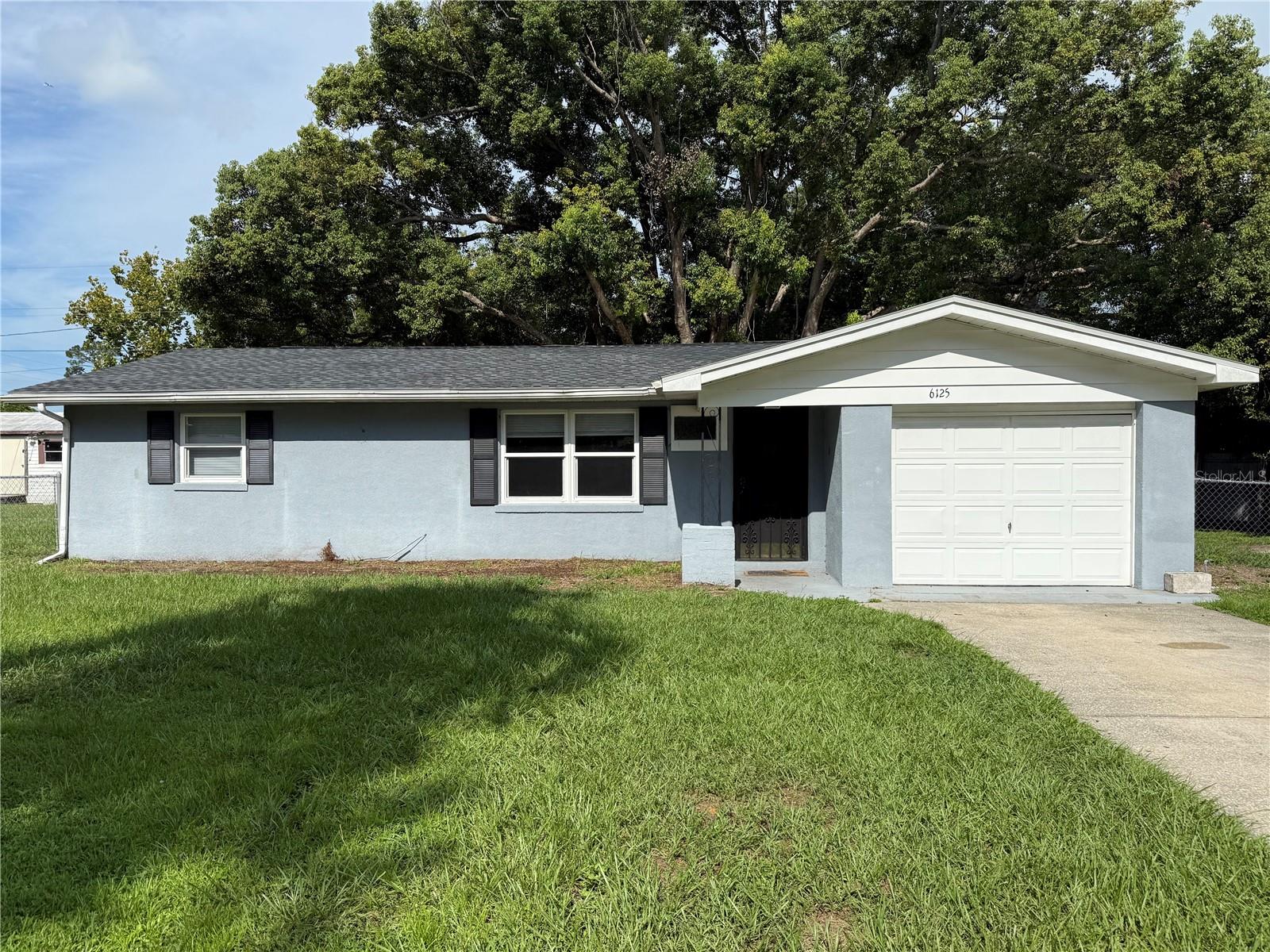 Under contract-accepting backup offers. This is an As-Is sale. This is a solid 2 bedroom, 1 bathroom home with a large Florida room to add flexibility(add a 3 bed & 2nd bath). It has an interior laundry room and all the comforts needed to call home. The roof was just replaced in 2025. The tenants just moved out and owner has decided to sell. AC, plumbing and electric all work. Located just minutes from town, shopping and dining. It is a great place to invest in, walking distance to the high school, and solid bones. It also has double-pane, vinyl insulated windows for maximum energy efficiency, save tons on your electric bill. There are mini blinds hung on all windows. The front yard features a big palm tree and a beautiful shade tree in the back to keep home cooler in summer time. Bring the dogs to roam in the fenced back yard with 2 gates and cross-fencing. Hurry!