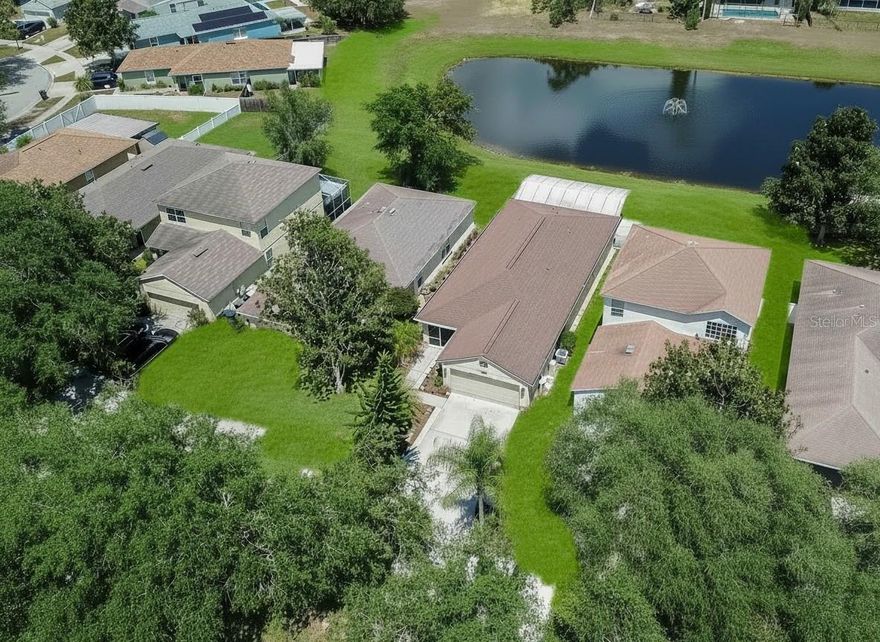 Beautifully updated, impeccably maintained, and set on a serene pond, this 3-bedroom, 2-bath home with a flexible office/4th bedroom showcases Florida living at its finest. Approximately 1,900 square feet of living space includes about 1,500 sq ft under A/C and a 400 sq ft covered, waterfront lanai that invites year round enjoyment of tranquil water views. Inside, the refreshed chef’s kitchen shines with granite countertops, stylish tile backsplash, undercabinet lighting, hardwood cabinetry, and stainless steel appliances. Light filled living spaces flow effortlessly, creating a one of a kind home designed for both everyday comfort and easy entertaining.
More than $80,000 in thoughtful improvements set this residence apart. Along the rear of the lanai, full width electric shade screens provide privacy and comfort for morning coffee or sunset unwinding. Move in with confidence thanks to PGT hurricane impact windows and sliders, a state of the art 8 camera security system, newer roof (2019) with premium GAF Elk Timberline Prestique shingles, new soffits and LeafFilter protected gutters, newer A/C, Culligan water softener and whole house filtration system, and fresh interior paint. The tankless Rheem Point of Use water heater delivers endless, immediate hot water—no more cold showers. Even the attic is upgraded with Bora foam anti termite spray insulation that saves big on the electric bill, and convenient pull-down metal stairs. A charming screened front porch and a fenced backyard complete this picture-perfect property.
All of this is in Panther Trace—one of Riverview’s premier communities—just minutes to I 75, Tampa, shopping, dining, and daily conveniences. Community amenities are exceptional: two full clubhouses, two pools (resort style and lap), splash pad, fitness center, tennis and basketball courts, multiple playgrounds, and miles of walking and biking trails.
Quality upgrades, peaceful water views, and a premier location—this move in ready home truly stands above new construction or anything else out there in this price range. Welcome home.