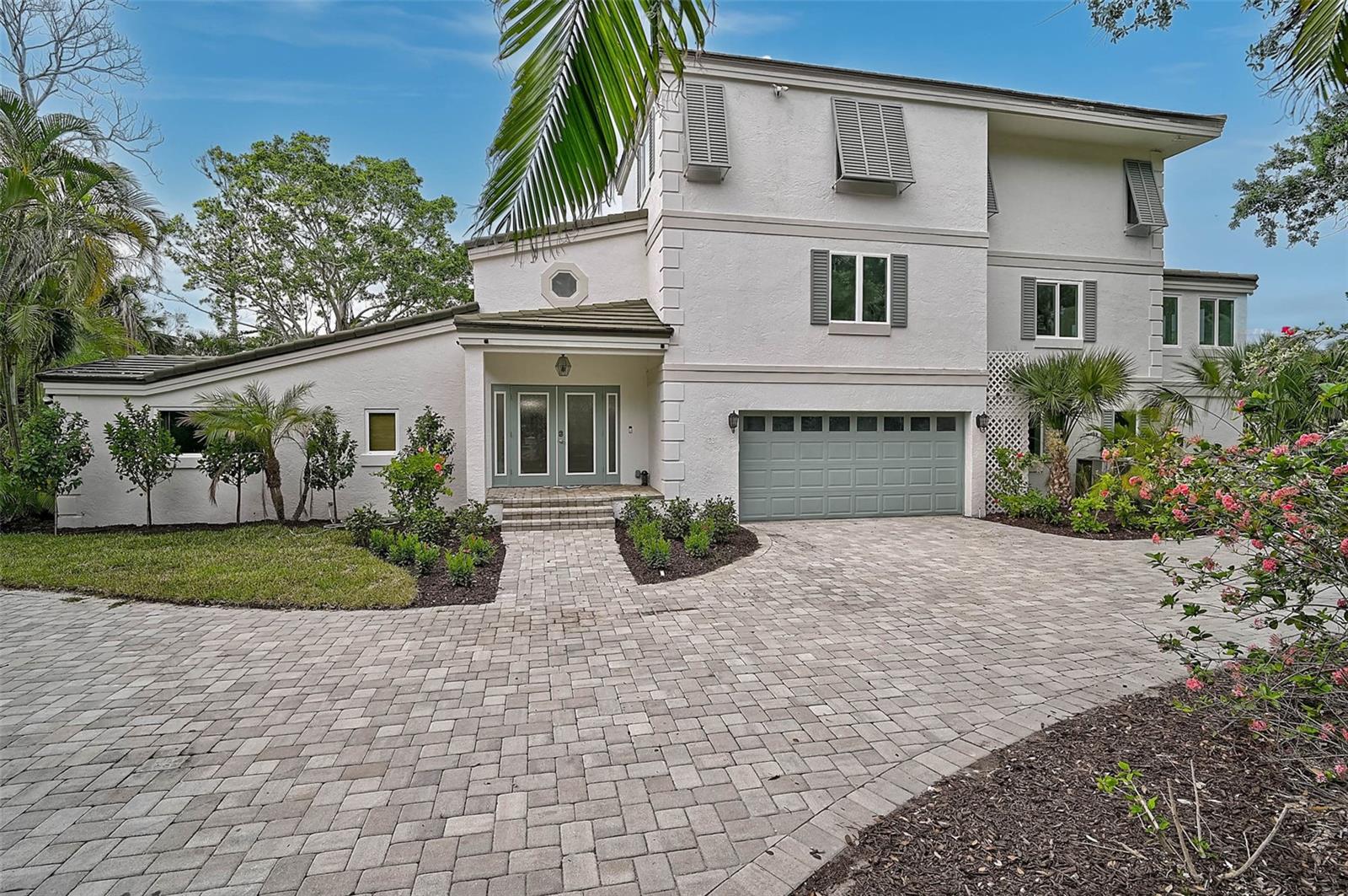 Luxury Canal-Front Oasis in Siesta Key | 4831 Primrose Path
Updated Three-Story Waterfront Retreat with Designer Touches & Flexible Living Spaces
Discover the perfect blend of luxury, comfort, and location at 4831 Primrose Path, a beautifully updated three-story canal-front residence situated on a lush corner lot in one of Siesta Key’s most sought-after neighborhoods. This elegant coastal home offers a rare combination of versatile living space, high-end upgrades, and tranquil waterfront charm—just minutes from Siesta Beach, dining, and shopping.
Primrose has a light and airy feel reminiscent of California coastal homes, featuring light wood floors throughout the second and third floors. The interior is painted a soft white and filled with natural light, creating a serene and uplifting environment. Surrounded by lush greenery, the home offers exceptional privacy and stunning birdwatching views from every level.
Main Floor – Open, Inviting, and Beautifully Renovated
The spacious first level welcomes you with high-end 4x4 porcelain tile flooring, a bright open-concept living area, and seamless access to the outdoors. Three generously sized bedrooms and three fully remodeled bathrooms provide ample comfort for guests or family. The designer kitchen features premium cabinetry, sleek modern appliances, and a side slider opening to a private courtyard—perfect for quiet mornings or evening gatherings. Large glass sliders frame your view of the tropical backyard oasis, where a sparkling pool and peaceful canal backdrop create the ultimate retreat for entertaining or unwinding in true Florida style.
Second Floor – Flexible Space for Modern Lifestyles
Upstairs, a versatile open loft offers endless possibilities: a home office, fitness studio, therapy room, or children’s play area—tailored to meet your lifestyle needs.
Third Floor – A Private Master Sanctuary
The entire third level is dedicated to the primary suite, offering abundant natural light, total privacy, and a sense of serene seclusion. Whether you’re starting your day or winding down, this space invites relaxation and renewal.
Highlights & Upgrades
• New designer tile flooring throughout the first level
• Fully renovated bathrooms with upscale finishes
• Custom kitchen cabinetry and premium appliances
• Fresh interior paint, new baseboards, and professional landscaping
• Direct canal access with peaceful water views
Location Perfection
Ideally positioned just minutes from the world-renowned Siesta Key Beach, 4831 Primrose Path offers easy access to all the charm of island living—boutique shopping, gourmet dining, and the vibrant Siesta Village lifestyle.
Move-in ready and thoughtfully updated, this exceptional canal-front home is a rare opportunity to live the Siesta Key dream. Schedule your private tour today.
