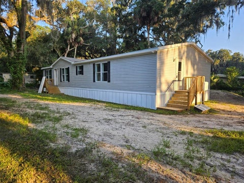 Photo of 3050 Cr 418, Lake Panasoffkee, FL 33538 (MLS # O6437108)