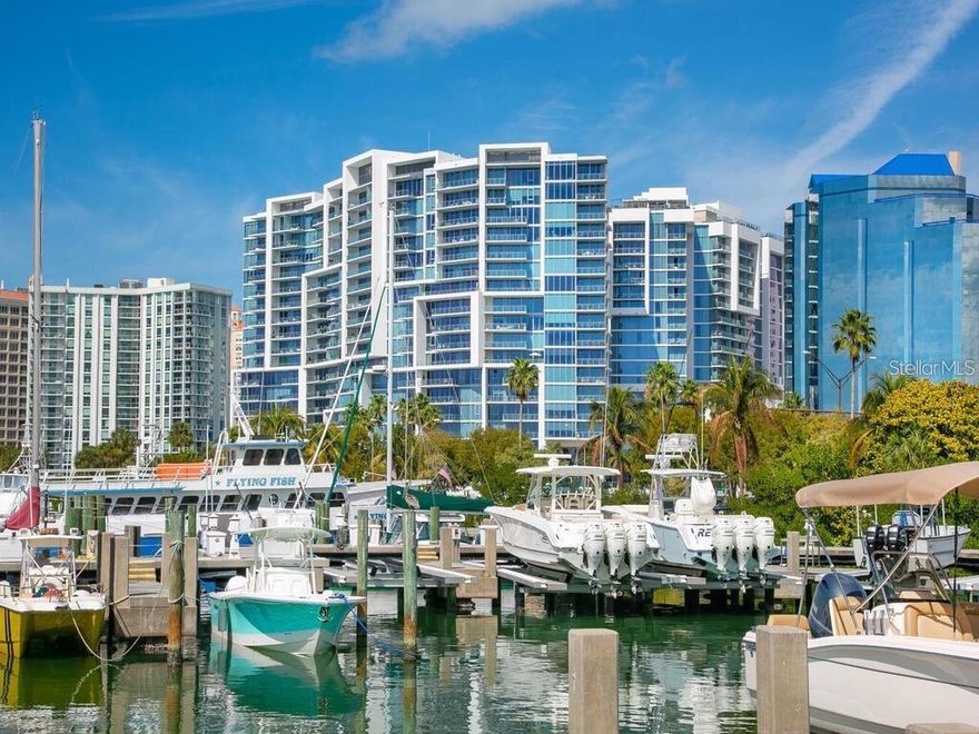 Indulge in the epitome of luxury living as you awaken to the awe-inspiring vistas of Sarasota Bay, greeted by a radiant sunrise that sets the tone for your day and bid farewell to daylight with the enchanting spectacle of a Sarasota sunset. Step into your sanctuary via a semi-private elevator, whisking you to your exclusive foyer where comfort awaits. Revel in the expanse of an open floor plan adorned with exquisite upgrades, meticulously curated to elevate every moment of your residence. For a comprehensive list of these features, refer to the special features sheet. Craft culinary masterpieces in a kitchen adorned with Highland Magnolia cabinets, Crema granite countertops, and equipped with top-of-the-line amenities including an induction stove top and a reverse osmosis water filter, ensuring a heightened gastronomic experience. Traverse across Homewood Hickory natural smoked wood floors that grace the living room, kitchen, hall, entrance, and den, exuding warmth and sophistication. The Kettmaker Vita wall system exudes elegance, while the Hubbardton Forge Mackintosh Oval Pendant illuminates the dining room with refined grace. Convenience meets luxury with additional enhancements such as a laundry sink for ease, California closets in the pantry, and walk-in closets in both bedrooms, offering unparalleled organization and storage solutions. Beyond the confines of your residence, embrace a lifestyle of leisure and wellness with access to a fully equipped gym, a sparkling swimming pool, spa, an outdoor grill for al fresco dining, all within walking distance of downtown amenities including trendy bars, gourmet restaurants, and chic boutiques. Embrace the Sarasota lifestyle and elevate your everyday living to extraordinary heights.