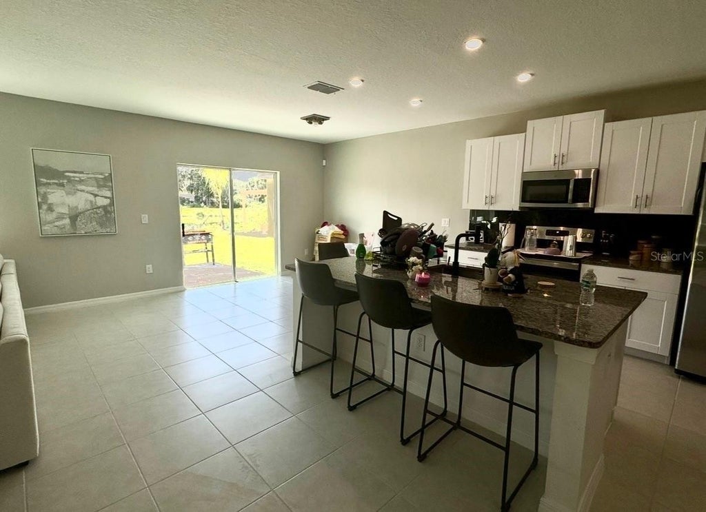 Photo of 4049 Capri Coast Drive, Plant City, FL 33565 (MLS # O6439356)