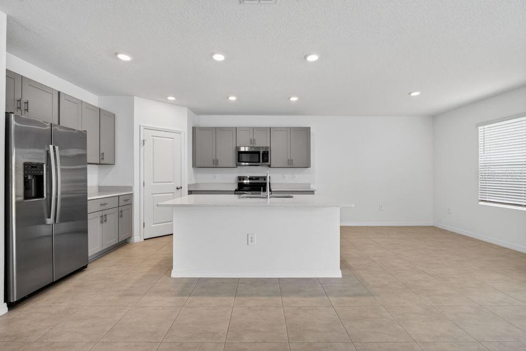 Photo of 13655 Tropical Breeze Way, Hudson, FL 34669 (MLS # TB8412297)