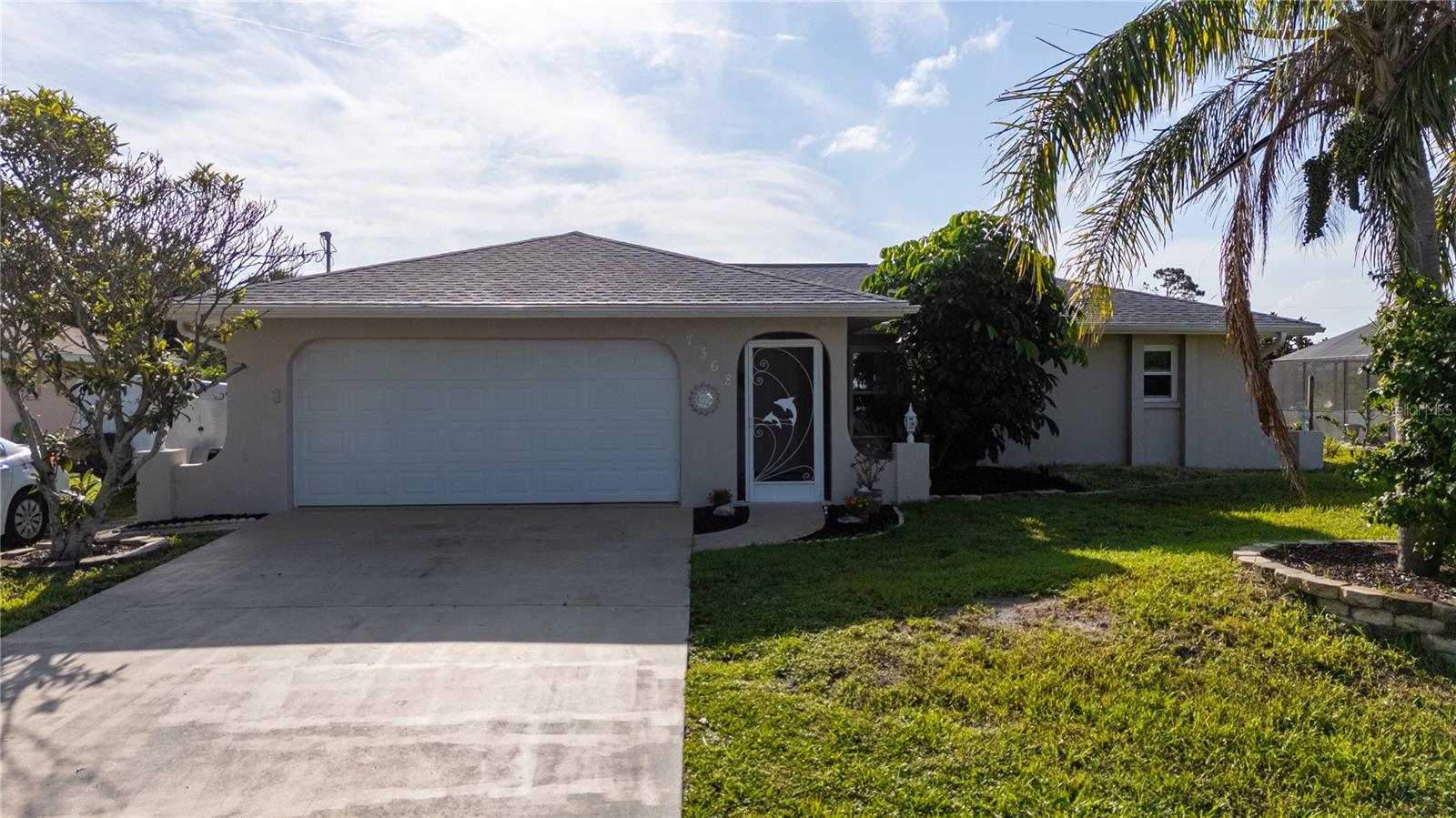 Experience the ultimate in Florida living with this beautifully updated 2-bedroom, 2-bathroom pool home in the heart of Englewood, perfectly situated on a spacious 0.23-acre lot in a coveted X flood zone with no HOA and no CDD. This home features impact glass windows for enhanced safety and efficiency, a well-appointed kitchen with newer stainless steel appliances, and seamless access to a private screened-in pool and expansive patio—ideal for entertaining or quiet retreats. Enjoy peace of mind with a roof replaced in 2020 and a water heater updated in 2016, along with an attached garage offering generous storage. Just minutes from Englewood’s pristine beaches, golf courses, and dining, this property delivers an exceptional blend of style, comfort, and location—whether as a year-round residence, seasonal escape, or investment opportunity.