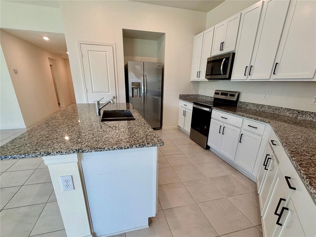 Photo of 240 Summerlin Loop, Haines City, FL 33844 (MLS # L4965969)