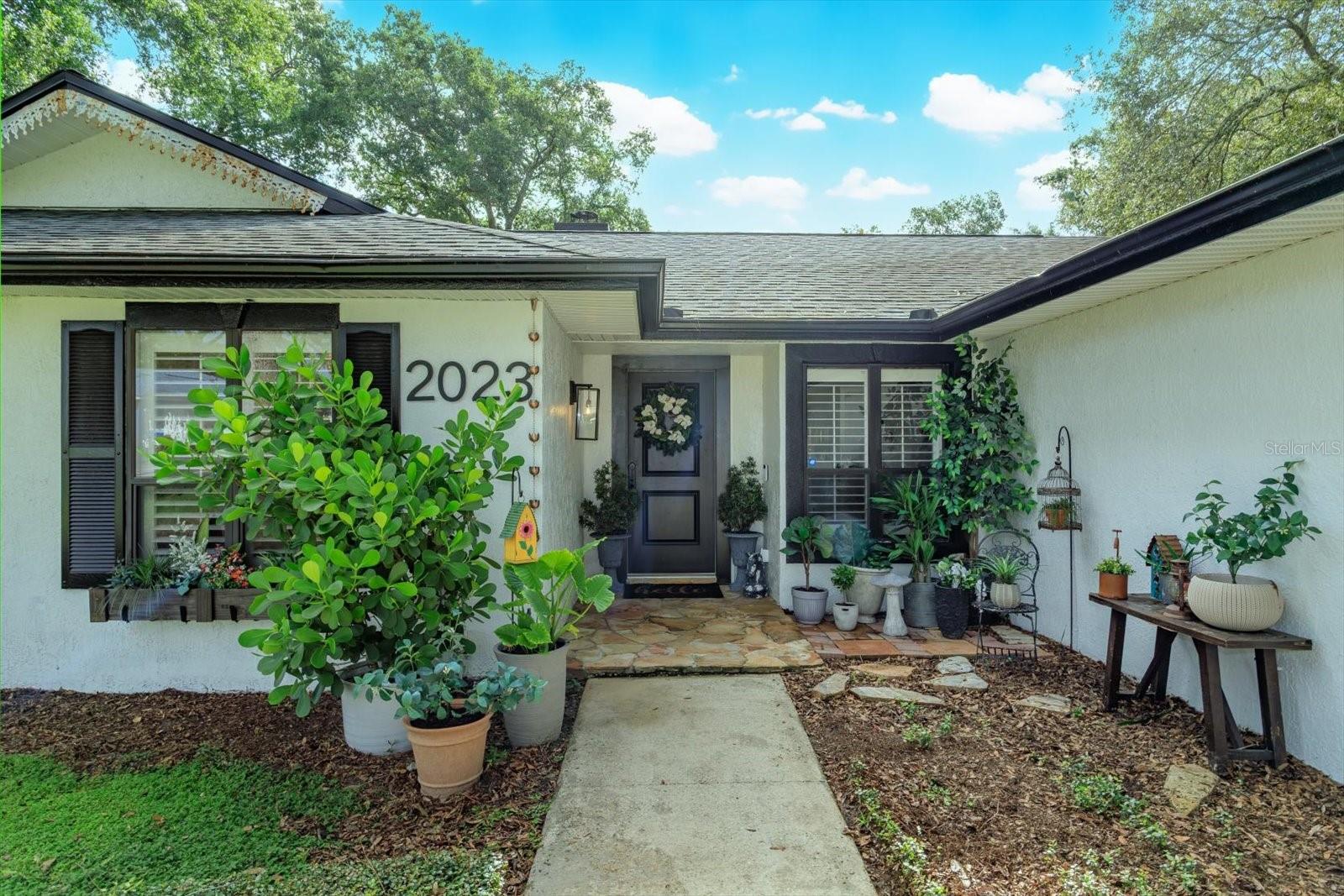 One or more photo(s) has been virtually staged. This beautifully updated 3/2 POOL HOME offers stylish comfort and thoughtful upgrades throughout. Inside, you’ll find rich wood floors, fresh interior paint, upgraded lighting and fixtures, renovated bathrooms, and a striking custom (working) fireplace that anchors the spacious living room. The open layout allows the kitchen and living areas to flow seamlessly—perfect for gatherings and everyday living.
Curb appeal shines with new exterior paint, a welcoming front door, and lush landscaping, plus a new fence and double row insulation. Outdoors is your own private retreat: a screened, heated pool and spa with a newer filter, ideal for relaxing or entertaining year-round.
With its modern touches and timeless charm, this move-in ready home offers both comfort inside and an entertainer’s paradise outside. Don’t wait—schedule your showing today!