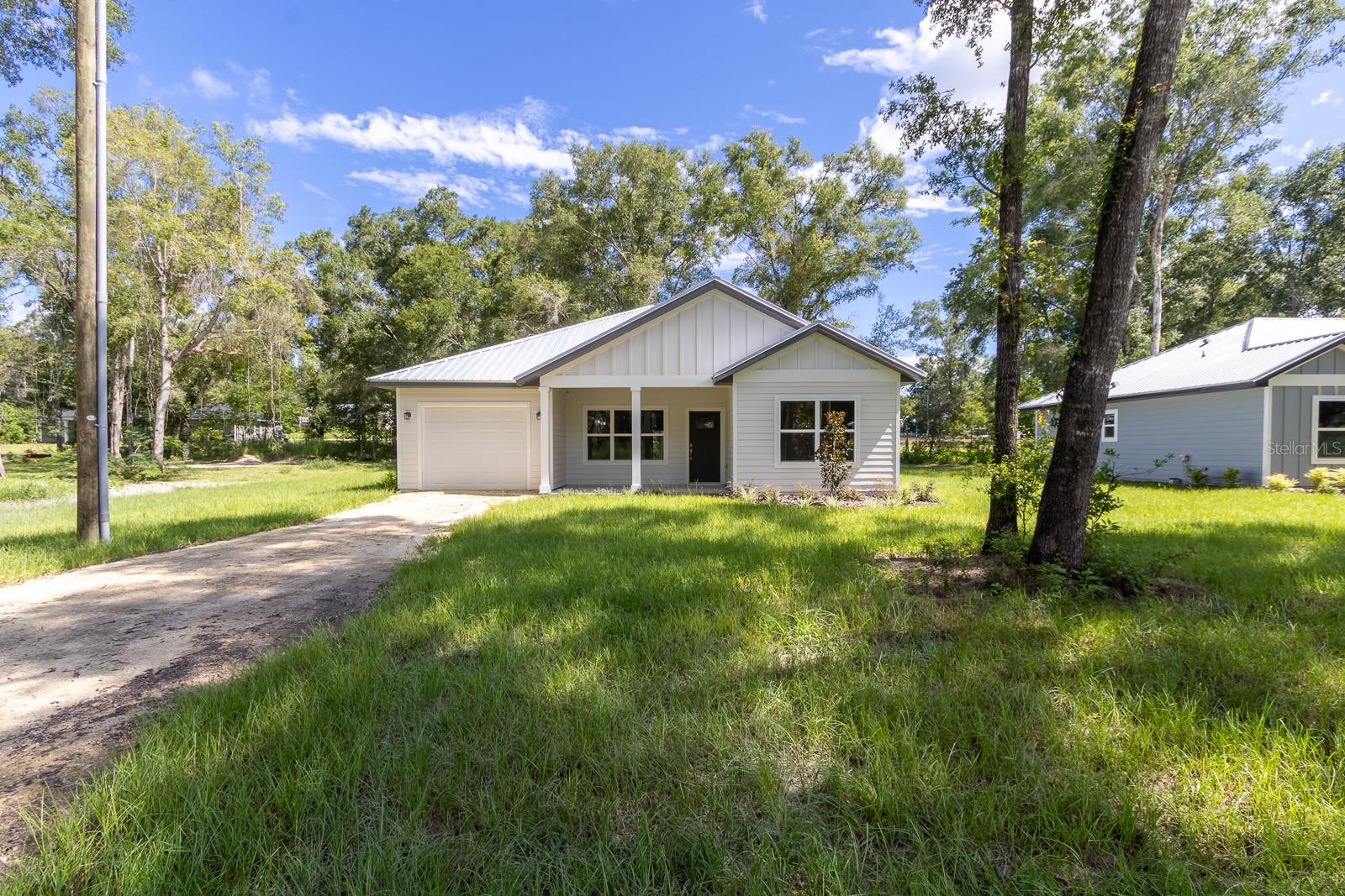 Under Construction. Quiet Country Living! Welcome home to this brand-new construction home in Sun n Fun. Offering 3 bedrooms, 2 bathrooms and 1189 square feet of living space. Featuring white wood cabinets, Granite Countertops, Vinyl plank flooring and carpet in the bedrooms. Exterior has hardiboard siding and a metal roof. Carport with a front and back covered porch. Don't miss out on this great home, tour it today!