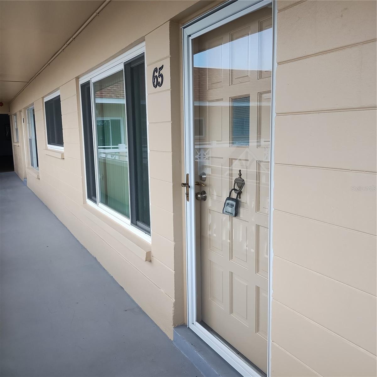 No flood Zone here! Very appealing two bedroom, two bath condo "HOME" on the third floor. Included is basic cable and internet service. This charming home features many newer updates which include new A/C heat and air installed 2022. Crown molding and in living room. The kitchen has stainless steel appliances including a dishwasher and beautiful ceramic tile backsplash. Florida sunroom area would make a wonderful area for an office. The master bedroom is king-size and features two large closets. It has its own en-suite bathroom with a walk-in glass shower and vanity. The guest bedroom is nicely sized with a ceiling fan and a its own closet. The condo features newer luxury vinal flooring. This 55+ community offers many amenities such as pools, a Lake with an added fishing pier, a walking trail, including a dog park, heated pools and spas, a very active clubhouse with various scheduled activities, free golf for owners an 18 hole and a 9-hole golf course, a gym, billiards room, ping pong tables, tennis courts, shuffleboard, outdoor and covered with grills picnic area overlooking dock and pond Free Bus service, many clubs, dances, and much more activities. Close to restaurants, mall, and incredible beaches. Come and see what living your best life could look like at on top of the world.