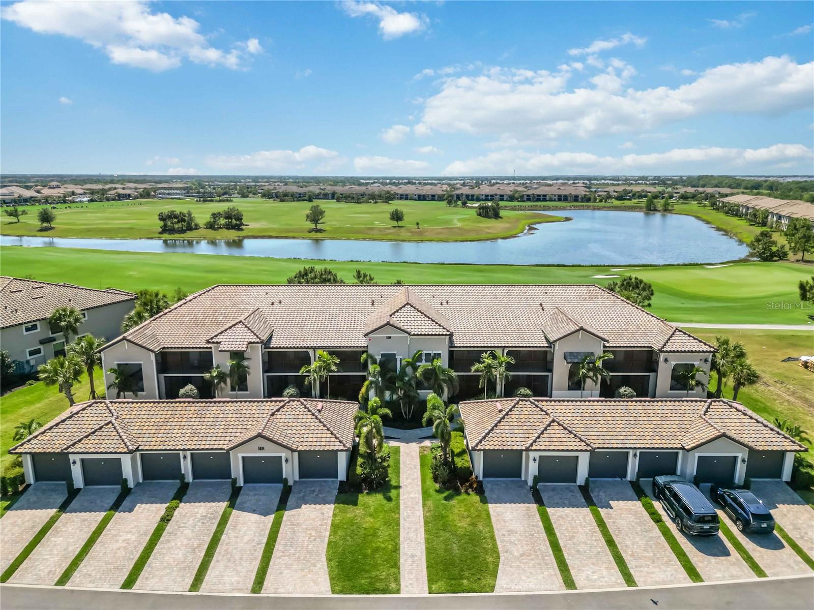 PRICE REDUCED! Turn-key (see furniture not included list) luxury golf course deeded condo in Lakewood National! This beautifully maintained unit features 2 spacious bedrooms, a den/office, gourmet kitchen, large family room with dry bar, and dining area with golf course views. Enjoy two screened-in patios and a detached 1-car garage. Resort-style amenities include 36 holes of Arnold Palmer-designed golf, heated pool with waterfalls and lap lanes, Tiki bar/café, fitness center, full-service spa, tennis, pickleball, bocce & more!