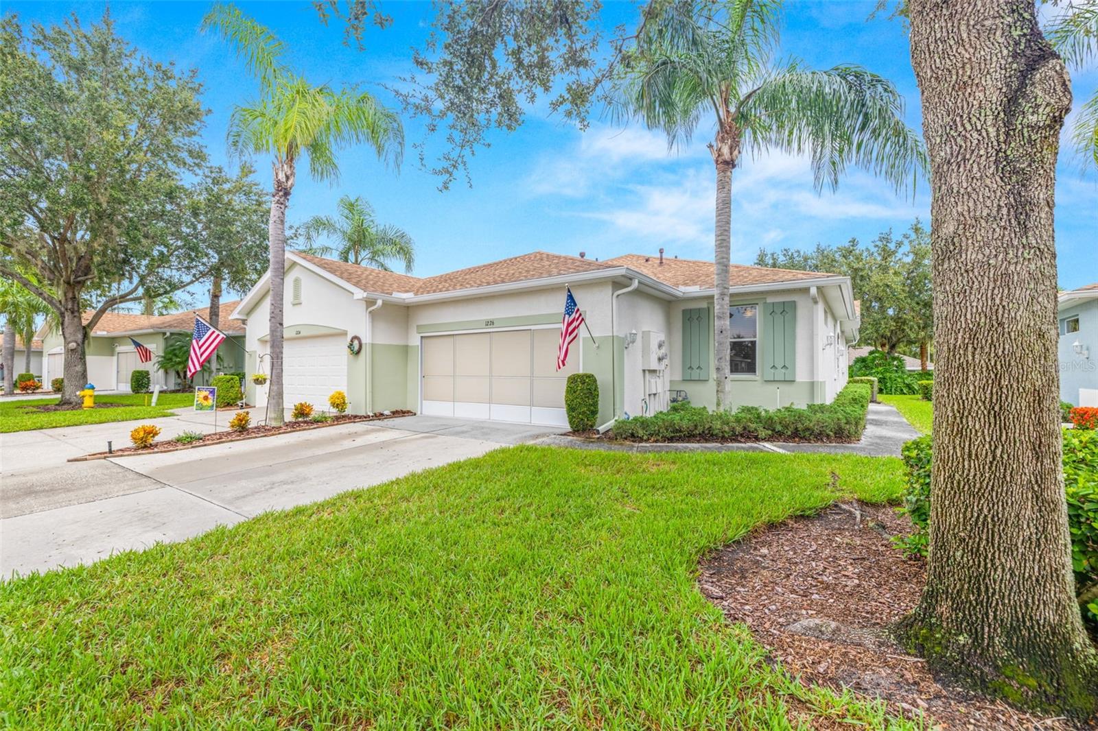 Stop your search—this home truly has it all for your Florida dream retirement!
Located in the highly sought-after 55+ gated community of Kings Point in Sun City Center, this end-unit Kingston floor plan is perfectly situated on a quiet cul-de-sac in Huntington Greens. This villa offers spacious, open-concept living with 2 bedrooms, 2 full baths, and an oversized Florida room.
The Florida room alone spans 288 sq. ft., featuring custom shades and its own energy-efficient mini AC system. With sweeping views of the meticulously maintained landscaping and no backyard neighbors, you’ll enjoy peace, privacy, and year-round comfort.
Inside, the open living room, dining room, and kitchen create an inviting flow, perfect for entertaining or relaxing. If you don’t need a formal dining room, that space can easily serve as a home office. Additional highlights include a kitchen equipped with breakfast bar, 42” upper cabinets and gas range, an indoor laundry and a two-car garage—offering plenty of storage for both your car and golf cart.
Kings Point offers the ultimate resort-style living, boasting endless activities and amenities. Two clubhouses—each with a restaurant, indoor & outdoor pool, and fitness center, dozens of clubs - from trivia and karaoke to pickleball, tennis, and lawn bowling and a vibrant social calendar just to name a few.
And when you’re ready to explore beyond the gates, you’re just a short drive to world-famous beaches, Tampa, St. Pete, and Clearwater.
