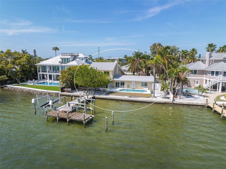 Great location WATERFRONT home centrally located in the heart of Holmes Beach on a quiet street on Anna Maria Island!! 90 feet of waterfront with gorgeous views!!!  There is a home on the property, but selling for lot value only.  Build your dream home and add your own finishes and personal style!  Imagine waking up to the beautiful sunrise every morning! Nature is right in your backyard, watch dolphins jump around and manatees swimming by. These lots on deep water are hard to come by!  Don't miss this rare opportunity with many possibilities with this property.