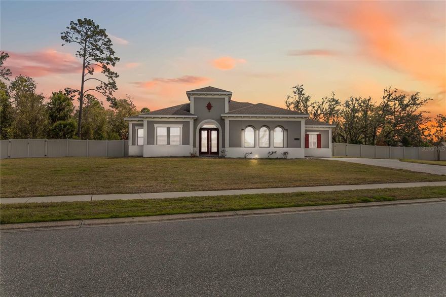 Experience luxury, space, and privacy in this stunning Bristol floor plan, a beautifully designed one-story estate home located in the gated community of The Estates at Wellington in Oviedo. Situated on an oversized, FULLY FENCED lot of more than one acre, this exceptional residence offers 4 bedrooms, 5.5 bathrooms, and a 3-car garage, combining elegant design with high-end features and expansive living spaces. Step inside to a thoughtfully designed open layout highlighted by extensive recessed lighting throughout the main living areas, a spacious family room, and a dedicated THEATER room with raised flooring, creating the ultimate setting for movie nights and entertaining at home. A SEPARATE OFFICE or study provides the ideal space for working remotely or quiet productivity. At the heart of the home is the gourmet kitchen, beautifully appointed with a large center island, pendant lighting, roll-out trays in the base cabinets, a GAS cooktop, and a bright breakfast nook that overlooks the family room and lanai—perfect for seamless indoor-outdoor living. The luxurious owner’s suite serves as a private retreat, featuring two spacious walk-in closets and a spa-inspired bathroom with dual vanities, a soaking tub, and a separate walk-in shower. Step outside and enjoy Florida living at its finest with a luxury pool and spa, complemented by an expansive screened-in paver patio and lanai, ideal for entertaining, relaxing, or enjoying the peaceful surroundings of your expansive backyard. This home also features full-home SOLAR PANELS, helping significantly reduce energy costs and providing exceptional efficiency for everyday living. Additional upgrades include a tankless water heater and TWO TESLA chargers installed in the three-car garage, blending sustainability with modern convenience. Ideally located in the heart of Oviedo, residents enjoy close proximity to Oviedo Mall, Oviedo Medical Center, local parks, dining, and shopping, along with convenient access to major roadways connecting you throughout Seminole County and the greater Orlando area. The home is also just minutes from the University of Central Florida (UCF) and is zoned for top-rated Seminole County schools, making this one of the most desirable and in-demand locations in Central Florida. If you’ve been searching for an estate-sized property offering privacy, space, and convenience within a gated community, this exceptional home in The Estates at Wellington delivers a rare opportunity to experience the very best of Oviedo living.