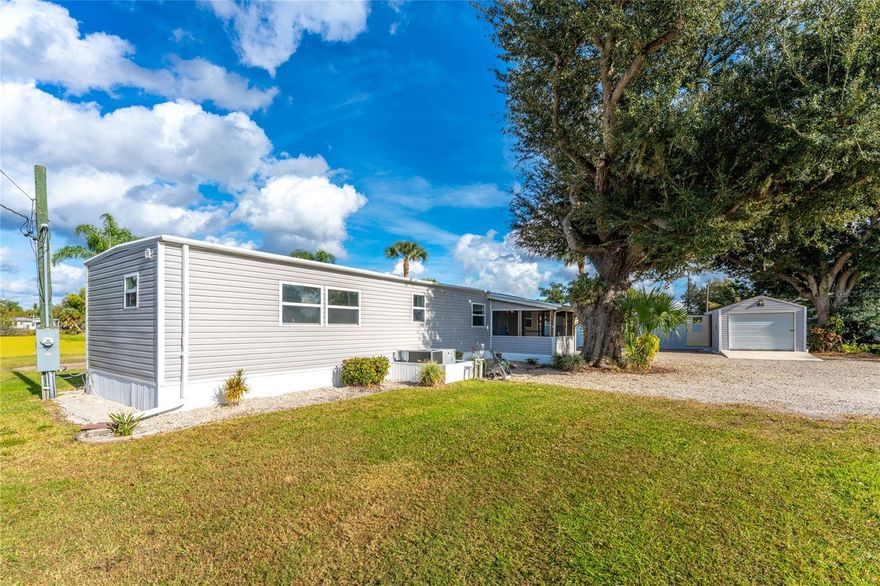 Take a look at this half acre, waterfront, mobile home property in Arcadia FL! This home has been lovingly remodeled and cared for with everything from luxury vinyl plank flooring, recessed lighting, fixtures and granite throughout. This unique property is at the very end of a quiet street with no thru traffic with a long water view. There are three sheds offering ample room for storage and possibility for workshop. The kitchen is open to the living room, light and bright featuring a large island with cooktop/oven built in. Owner went the extra mile and installed a Reverse Osmosis drinking water system. The split floor plan has the Primary bedroom with sliding Barn doors and En-Suite Bathroom just off the kitchen and the guest room on opposite side of the home, just off the Living room with its own bathroom. Both Bathrooms have been updated with new vanities, granite, custom tiled showers and new fixtures. All the well equipment has been newly replaced July 2025 including a water softening system. You may not find a larger laundry room than this with custom tiled floors, butcher block counter tops, ceiling fan and its own sink. The expansive lanai has space for dining table and outdoor living room with gliding windows along both the side and back wall with a set of French doors. Seller is offering a Home Warranty to the buyer for peace of mind. NO HOA, Lot Rent or other Community Fees! 11916 SW Newman Terr is located less than 2 miles from i-75, and is nearby shopping and restaurants. Be sure to read the comments on each photo for more property details. This little piece of paradise is waiting for you here in SWFL.