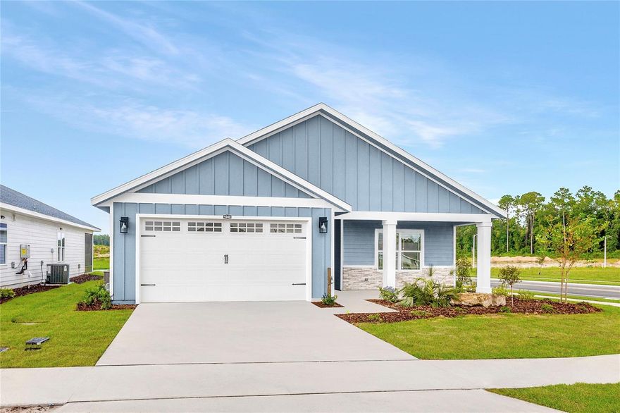 Pre-Construction. To be built. Set in Tanglewood in Newberry, FL, The Sequoia by William Weseman Construction puts you in the middle of what makes this part of Alachua County so appealing: the small-town charm of Newberry and the conveniences of Jonesville and Gainesville. Built by a 3rd-generation local builder, this new construction home blends practical design, durable materials, and polished finishes. This 3-bedroom, 2-bath plan offers 1,642 heated and cooled sq ft with a split-bedroom layout designed for comfortable everyday living. The open great room creates a bright central gathering space, with the kitchen overlooking both the dining area and living room. Unlike many homes in this size range, The Sequoia offers abundant cabinetry, generous counter space, and a pantry cabinet for additional storage. Quartz countertops, solid wood cabinets with soft-close drawers, tile backsplash, pull-out dual trash bins, and a stainless steel under-mount single-basin sink create a polished, practical kitchen. Included appliances are a stainless steel slide-in electric range, microwave, and dishwasher. The primary suite is privately located at the rear of the home and includes a spacious walk-in closet that connects directly to the laundry room (w/ sink). The primary bathroom features dual sinks, a full tile shower, and a private water closet. Two additional bedrooms and a full bathroom with tub are located toward the front of the home, with a linen closet between them. The large covered side porch expands the living space outdoors. Additional interior highlights include LVP flooring throughout, ceramic tile in bathrooms, 9' ceilings, recessed LED lighting, and ceiling fans. The HVAC system and water heater are tucked into the garage in a way that preserves parking, storage, and workspace. Exterior details include stacked stone accents, Hardie board siding with spacer clips and board-and-batten accents, 12"x12" columns, low-maintenance aluminum soffits, a fully sodded Zoysia yard, and a 2-car garage with an 8' door. Energy-smart features include Low-E windows, R-30 insulation, 15 SEER HVAC, electric water heater, and wi-fi enabled thermostat and garage door opener. Buying at this stage offers buyer design selections and personalization, with choices and upgrades available including, but not limited to, roof shingle color, exterior paint color, stone accent color, cabinet color, countertops, interior paint color, front door, and interior door style. Tanglewood’s planned amenities include a pool, playground, pickleball, covered pavilion, and sidewalks on both sides of the street. The $95/month HOA includes access to future amenities plus front yard mowing and maintenance. Community services include Clay Electric, the City of Newberry, and Cox Cable. Zoned for Newberry Elementary, Oak View Middle, and Newberry High School (buyers should verify school zoning). The location also offers convenient access to daily essentials and area destinations: 2.5 miles to Publix, 5 miles to area schools, 5 miles to Tioga Town Center, 6.5 miles to Jonesville Park, 4.9 miles to Easton Sports Complex, 8 miles to Diamond Sports Park, 9 miles to I-75, 13 miles to UF, 9.3 miles to HCA Florida North Florida Hospital, and 15 miles to the VA Hospital and UF Shands Hospital. Estimated completion: June 2026. Lot 2 is a 55' x 120' homesite. Photos are of a previously completed similar home; finishes and selections may vary. Reach out for availability, construction updates, and the current selections list.