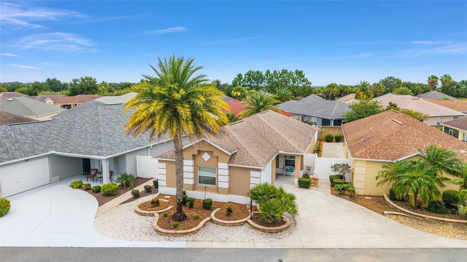 TURN KEY Cambridge style Courtyard Villa in the sought after Village of Hillsborough. This home is beautifully furnished, decorated and maintained. As you arrive, notice the mature landscaping, covered front porch and leaded glass entry door. Stepping inside, admire the engineered hardwood flooring (new 2023) and high ceilings. The large sliding doors, windows and bright walls (newly painted 2023) create a very welcoming space. The kitchen is nicely appointed with lots of storage including a pantry closet. The matching LG stainless steel appliances are new in 2023. Also notice the breakfast table with stools and the convenient pass through to the dining room. The main area of the house is spacious and perfectly proportioned for relaxing, entertaining or accessing the exterior patio area or the covered/screen lanai. Speaking of which, step out and enjoy the courtyard. This area has a combination of stone walls and fencing to provide great privacy. Notice the low maintenance landscaping, no grass. Continuing back inside, take a look at the primary suite located in the back corner for privacy. This suite also includes a walk-in closet, linen closet and private bath complete with dual sinks and a tiled walk in shower. The guest suite is located in the front corner of the house also for privacy. This suite includes a large closet and full bathroom. Another area worth mentioning is the garage with room for a car and golf cart. This area also has a nice laundry area complete with cabinet storage and utility sink. The garage door opener is new. Take a look at the beautiful photos and video. Picture yourself living in this very special home in this wonderful neighborhood and then call to schedule a private showing.