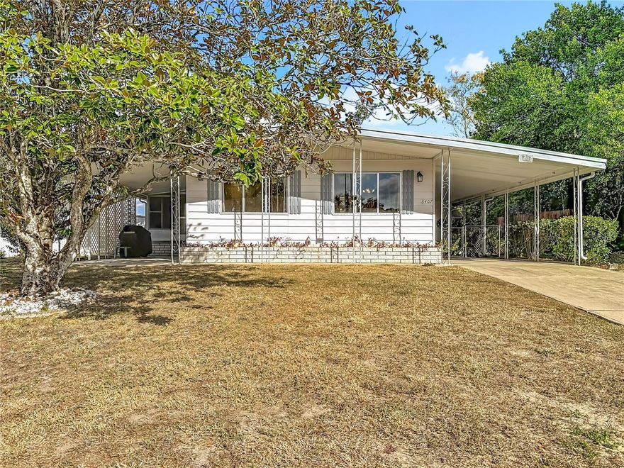 Welcome to this spacious 2-bedroom, 2-bathroom home situated in the highly desirable 55+ golf course community of High Point. This lovely home is perfect for year-round enjoyment or as a seasonal retreat. 
With most of the major updates done and with a little TLC this home can be transformed into a warm and inviting space, perfect for making lasting memories. Whether you choose to update the interiors, enhance the curb appeal, or simply add your personal touches, a little care and attention will unlock this property's full potential. From the moment you arrive, you will be greeted with a spacious front porch and a covered carport that leads to the large shed. Step inside to a nice open floor plan that leads to the expansive living room/dining room combo and is perfect for entertainment or relaxing with family. The nicely appointed kitchen offers ample space to prepare your meals. The roomy master bedroom features an ensuite with the master bathroom featuring dual sinks. The second bedroom offers generous space and easy access to the second updated bathroom with new tile flooring, new vanity, new toilet and new shower.  You will love the versatility of an additional back porch where you can enjoy your morning coffee or relax and unwind with a good book.  The huge, dedicated laundry room with storage is right off the back porch for your convenience. The fully fenced yard ensures privacy and security, making the outdoor space perfect for pets or entertainment.
 Recent updates and features include Roof 2015, new AC, newer water heater, new vapor barrier, new pillars and extra anchors for added support. Also added were new ¾ inch sub-flooring in the kitchen, master bathroom, hall and family room. High Point offers an array of amenities, including a heated pool, tennis courts, golf course, horseshoes, bocce, pickleball, a community center, and much more. Best of all, you own your land, and HOA fees remain low, maximizing value and enjoyment. Just minutes from the famous Weeki Wachee live mermaids, Pine Island Park, and Roger’s Park for endless fun on the water. Close to shopping, dining, major medical facilities, and the Suncoast Parkway for easy commutes to the airport, Tampa, Clearwater, St. Pete Beaches (ranked among the top five U.S. beaches), and the renowned Tarpon Springs Sponge Docks.