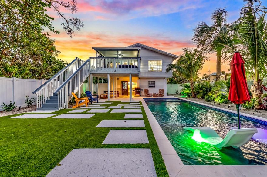 Waterfront North end of Anna Maria Island! Bring your boat and desire for relaxed island living! This adorably updated island home enjoys both boatable canal frontage in the backyard and access to the Gulf of Mexico's famous beaches only a short stroll from your front door. Beautiful Quartz counter tops, new appliances and coordinated pendant lights adorn your kitchen as it overlooks the dining room and views to your screened lanai and the back deck. The living room is sweeping with natural light and high vaulted ceilings. Down the hall you'll find your laundry, guest bathroom, two spacious bedrooms, a hall storage closet, the master bed and master bath. The two front bedrooms have sliders leading to the west facing balcony and sunset views. Renovation with permits was completed in 2022, along with the addition of the new pool and spa! The location and oversized lot of this canal front home also makes it a very attractive property to be a permanent residence, seasonal getaway or build your own island dream home!