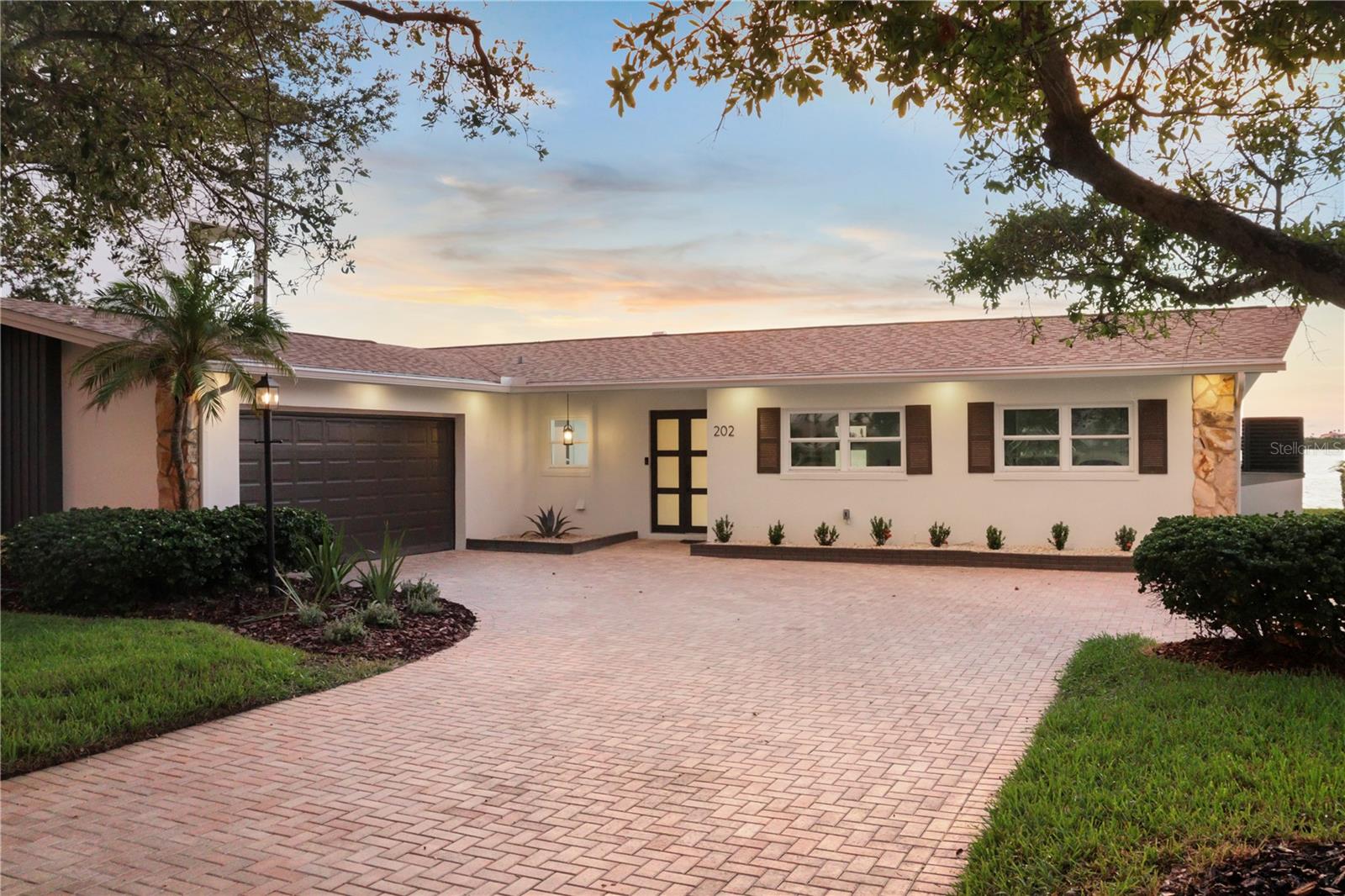Stunning Waterfront Retreat in Harbor Bluffs!
Welcome to this beautifully remodeled 4-bedroom, 3-bath home offering 2,235 sq ft of modern coastal living. Nestled on a desirable waterfront lot, this property blends luxury, efficiency, and boating convenience.
Step inside to a bright, open-concept floor plan with a fully renovated 2025 kitchen and bathrooms, featuring designer finishes, premium cabinetry, and quartz countertops. Large impact-rated sliding glass doors and windows (2025) flood the home with natural light while providing peace of mind and energy efficiency.
The home also boasts a 2025 HVAC system, ensuring year-round comfort, and a 2023 Sunrun-installed 15KW solar panel system—paid in full—for minimal energy bills. A 2019 roof adds further value and longevity.
For boating enthusiasts, enjoy a new 2025 dock complete with a 13,000 lb Neptune boat lift, making days on the water effortless. The backyard offers stunning water views, perfect for entertaining or quiet relaxation.
Additional features include a spacious 2-car garage, ample storage, and a split-bedroom layout ideal for family or guests.
This is truly a turn-key property with every major system recently upgraded—just move in and start living the Florida lifestyle!