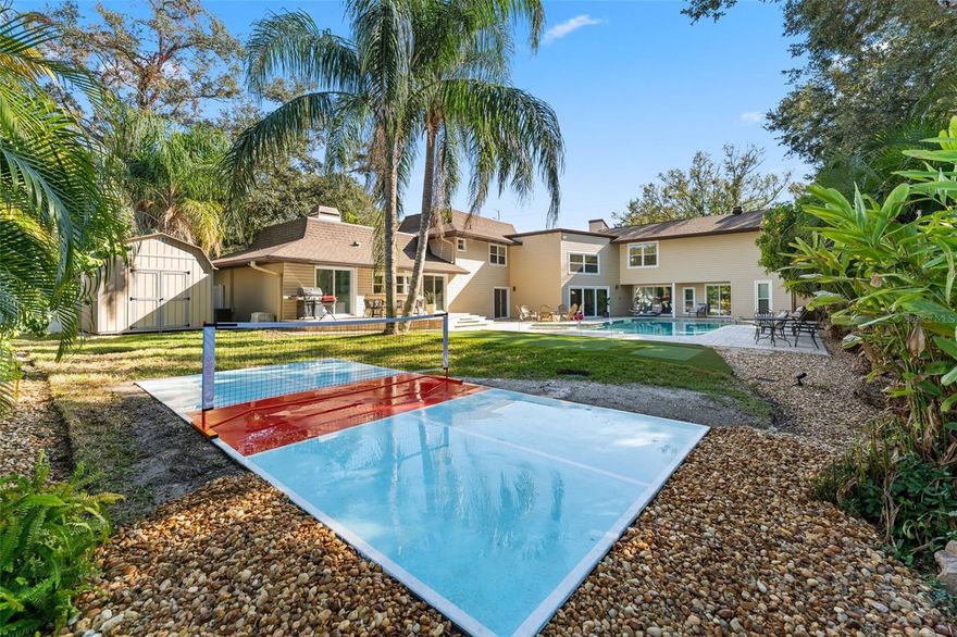 Welcome home! OR to your next brilliant investment. With over 5000 sq feet this luxury property is packed with endless amenities so sit tight. Tucked into a quiet UNINCORPORATED residential neighborhood with NO rental restrictions is a retreat you could call your own. Make it a home built for generational wealth or a short term rental with presentence of high performance. This estate has been run for over a year as a cash flowing AirBNB grossing on average 20k a month (can show AirBNB documents for proof). The home features THREE primary bed rooms (five bedrooms total) making it great for multigenerational families or if used as STR great for multiple families that want to share a place but also have their own space! All three of the primary bed rooms have their own full (his/hers) bathrooms and walk in closets. Two of the primaries are 1200 square feet of luxury overlooking the Olympic sized swimming pool and court yard. One of the primary bedrooms could easily be converted into a full in-law suite with a kitchenette, bedroom, walk-in closet, full bath, and private entrance to the pool. The kitchen was newly (cosmetically) renovated with brand new appliances, wood shaker cabinets, and stone counters that overlook the entertainment room. The entertainment room has a wet bar with a wine fridge great for  create unforgettable gatherings. The home has endless space featuring three living rooms with three custom fire places. The home features endless character and Feng shui. Some feature the home presents inside are: newer impact windows and sliders, newer electrical, 5 walk in closets, 2026 cosmetically renovated primary bathroom, private formal dining room, a home theatre, a gym and sauna room, stand alone soaker tub, security system on every door and window, 25 foot ceilings, and an original fire pole/spiral staircase from Clearwater's first ever built fire station from 1911. Luxury does not stop at the interior. Outside displays an underground drainage system for ANY potential flooding that stretches throughout the entire lot (no damage or flooding has happened in the 2024 major hurricanes or any previous), roof 2021, 2021 shed with a private boat gate entrance, irrigation system to keep your lawn and gardens pristine, parking for 10 or more cars, and more. The yard features a mini pickleball court, turf with mini golf, fire pit, outdoor dining space off the kitchen, privacy foliage filled with mango trees and tropical landscaping. Not to mention the HUGE swimming pool with a lap lane, Baja shelf and a sunken lounge. This is one of the most sought after areas in Clearwater and Belleair located only 6 miles from Clearwater Beach! Pictures truly cannot capture the beautiful character of this home. Book your private showing today! Can come furnished making it an easy turn-key move.