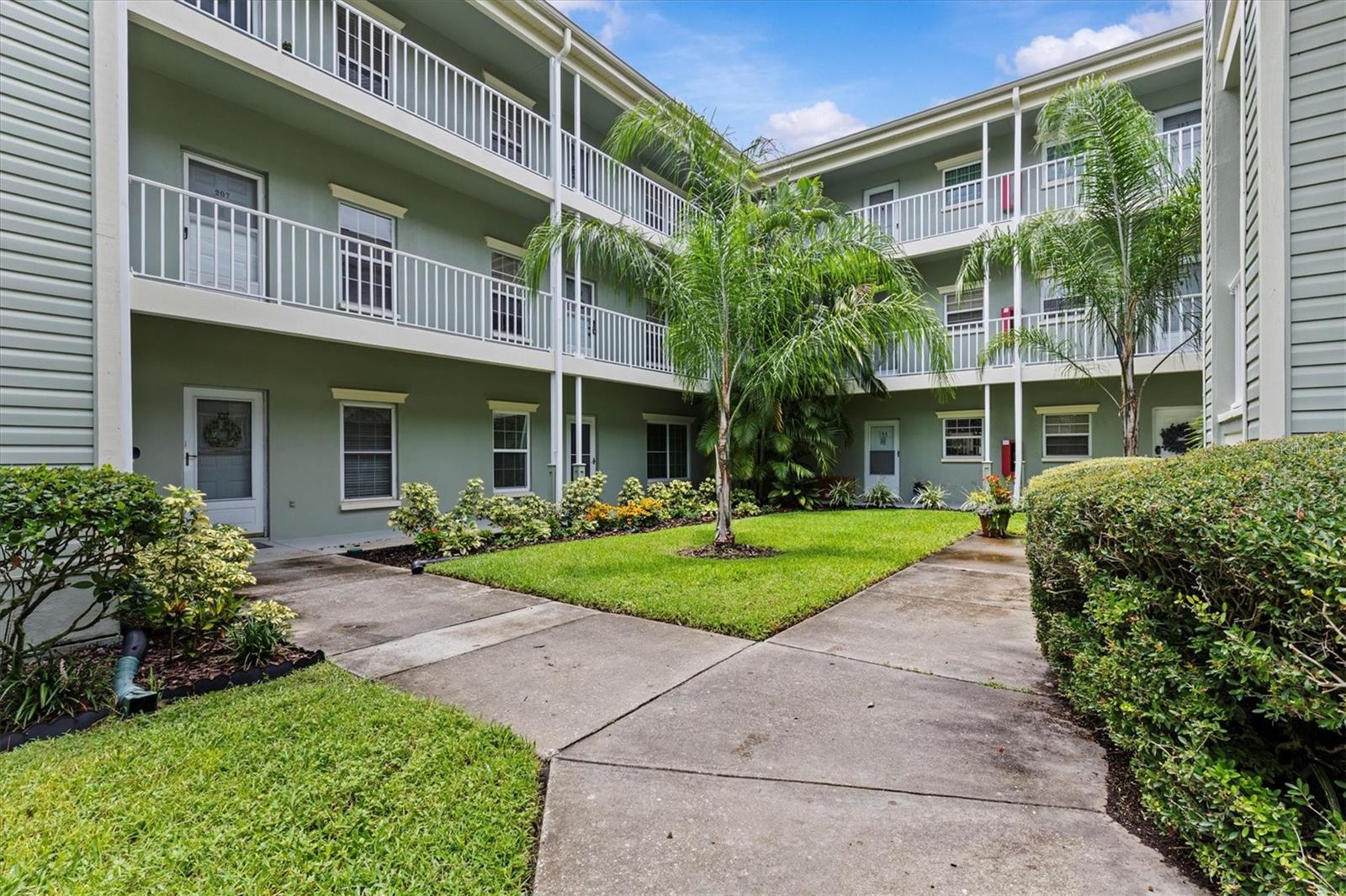 Welcome to this beautifully updated 2-bedroom, 2-bathroom condo in the heart of Dunedin! Located on the second floor with convenient elevator access, this corner unit offers extra windows for an abundance of natural light. With 1,090 square feet of thoughtfully designed living space, there's room for a dedicated dining area, plus a spacious inside laundry room for added convenience. Enjoy peaceful views of the pool and lush landscaping from your screened and covered balcony—perfect for relaxing mornings or evenings. The A/C was replaced in 2018, and the unit includes covered parking and a private storage space. The well-maintained community features manicured grounds, and a completed milestone inspection adds peace of mind. Don’t miss your opportunity to live just minutes from charming Downtown Dunedin, beaches, shopping, and more!