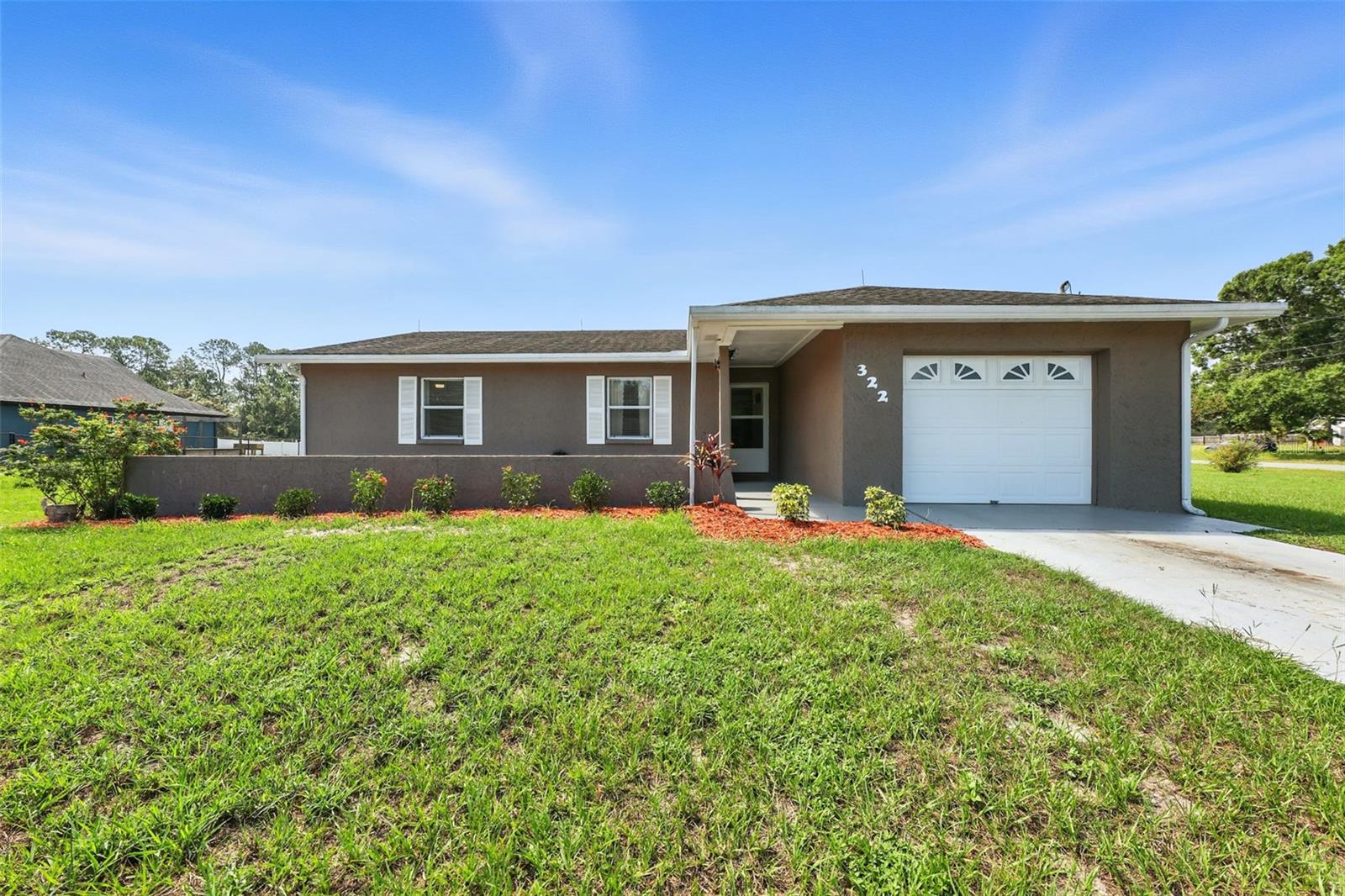 NO HOA! Bring your boat, RV, and toys to this beautifully updated 3-bedroom, 2-bath home sits on a spacious 1-acre corner lot just minutes from the theme parks. Recent updates include a modern kitchen with new cabinets, quartz countertops, updated flooring, and fully renovated bathrooms. Enjoy natural light through brand-new windows, relax in the enclosed sunroom, or take an evening stroll down quiet dead-end roads. The property also offers multiple storage sheds, an attached garage, and a large detached garage (with electric), storage, or extra vehicles. A whole-home Generac generator provides added peace of mind. CLOSE to CLERMONT, ORLANDO, and LAKELAND without the heavier traffic routes, this home combines comfort, convenience, and flexibility in one perfect package.