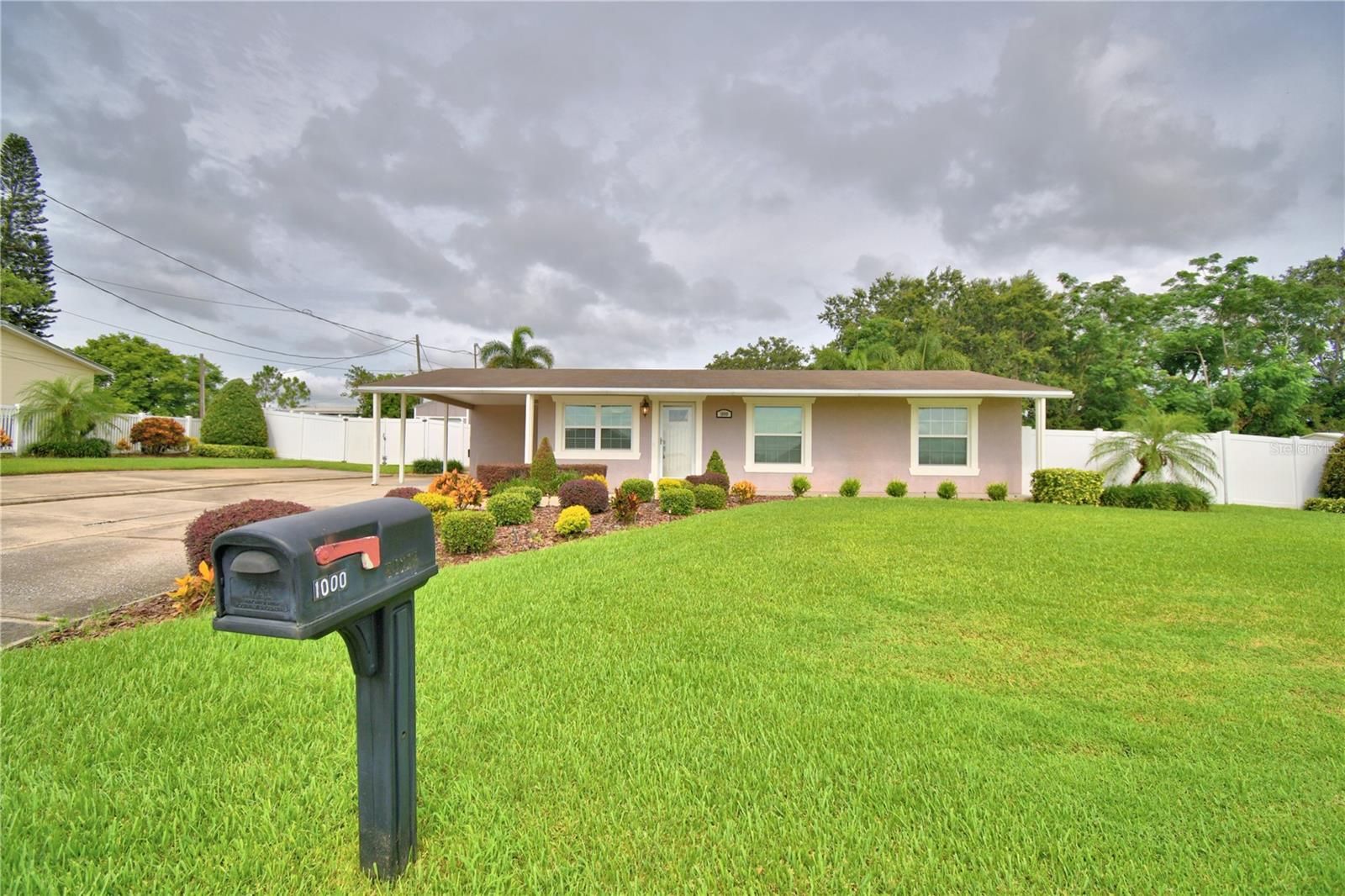 PRISTINE 3 Bedroom, 2 1/2 bath, beautifully landscaped POOL home. When entering the front door you are greeted with warm colors, crown molding and luxury vinyl flooring throughout. The kitchen features granite counters, tile back splash all the way around and up to the solid wood cabinets with soft close drawers. Oversized family room has it's own mini split AC, French doors out to the pool, pass thru window from the kitchen and step down access to the dining room/den. Dining room/den area with slight modification could be a 4th bedroom. Master not only has a built in closet in the main bedroom but also built in floor to ceiling cabinet and 7.3 X 7.9 walk in closet making the whole bedroom with closet 26.6 X 11. Master bath has safety bars in the tub shower combo. Bedrooms 2 & 3 are nice size and have access to the 2nd bath across the hall. This bathroom has tile floor to ceiling with Shower only with safety bars. Inside utility room is oversized at 11.2 X 7.4 so plenty of room for washer dryer and extra storage. The whole entire grounds are just amazing. Manicured landscaping with croutons, fox tail palms, box plants, sculpted viburnum hedges, 6' vinyl fenced back yard with single and double gate with separate side yard dog run area and gutters. AMAZING pool and enclosure is 23 X 36 attached to the home and just off the living room. Pool boasts of concrete seating, water falls and jets, lighting, salt filter, auto pool sweep with 1/2 bath and insulated roof panels in the covered space out from the living room. Outside the pool area has pavers for grill or loungers and access to the dog run. Back yard is a 10 X 10 Shed with roll up door for mower or work shop & additional parking which would allow for boat parking, golf cart, estimated total of 7 parking spaces. Extras, Fire Hydrant IN the corner of the yard, sprinkler well, 4 zone irrigation. Come take a look at this beauty.