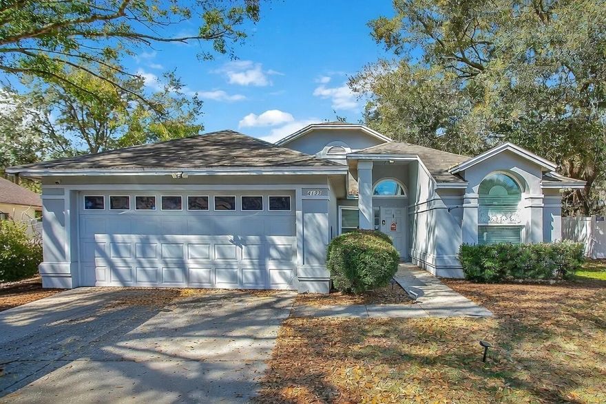 Charming Walden Lake Home – This beautifully maintained 3-bedroom, 2-bath residence in Plant City’s sought-after Walden Lake community has modern upgrades and timeless appeal. The home was re-roofed in 2016 and received new energy-efficient windows and a new A/C system the same year. Inside, an open layout connects the living room, family room and kitchen, all highlighted by soaring ceilings and a cozy wood-burning fireplace. The kitchen features stone countertops, a breakfast bar and a clear view into the family room, making it great for entertaining. The owner’s suite includes a walk-in closet and private bath, while two additional bedrooms share a full bath on the opposite side of the home. Sliding doors lead to a covered rear porch and fully fenced yard with mature landscaping—awesome for pets or a future pool. Walden Lake residents enjoy amenities such as walking trails, parks, a lake for fishing/kayaking, tennis courts and a golf course. With quick access to downtown Plant City, Tampa and Lakeland, this move-in ready home blends convenience, comfort and community.