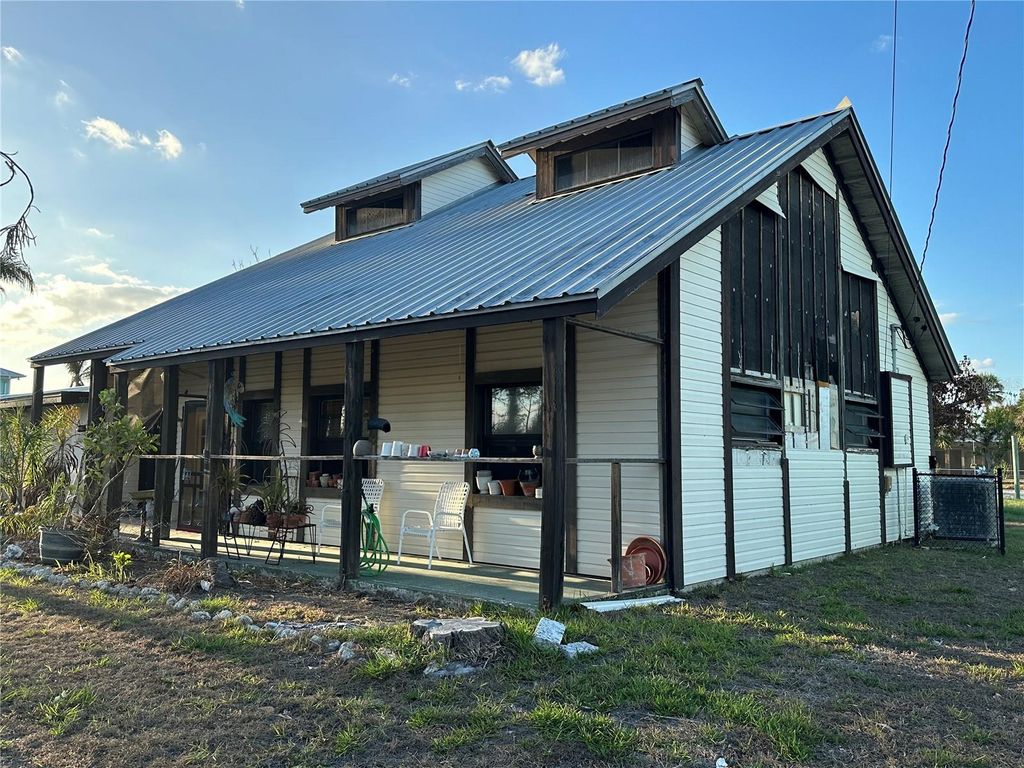 Photo of 1926 Massachusetts Avenue, Englewood, FL 34224 (MLS # D6138954)