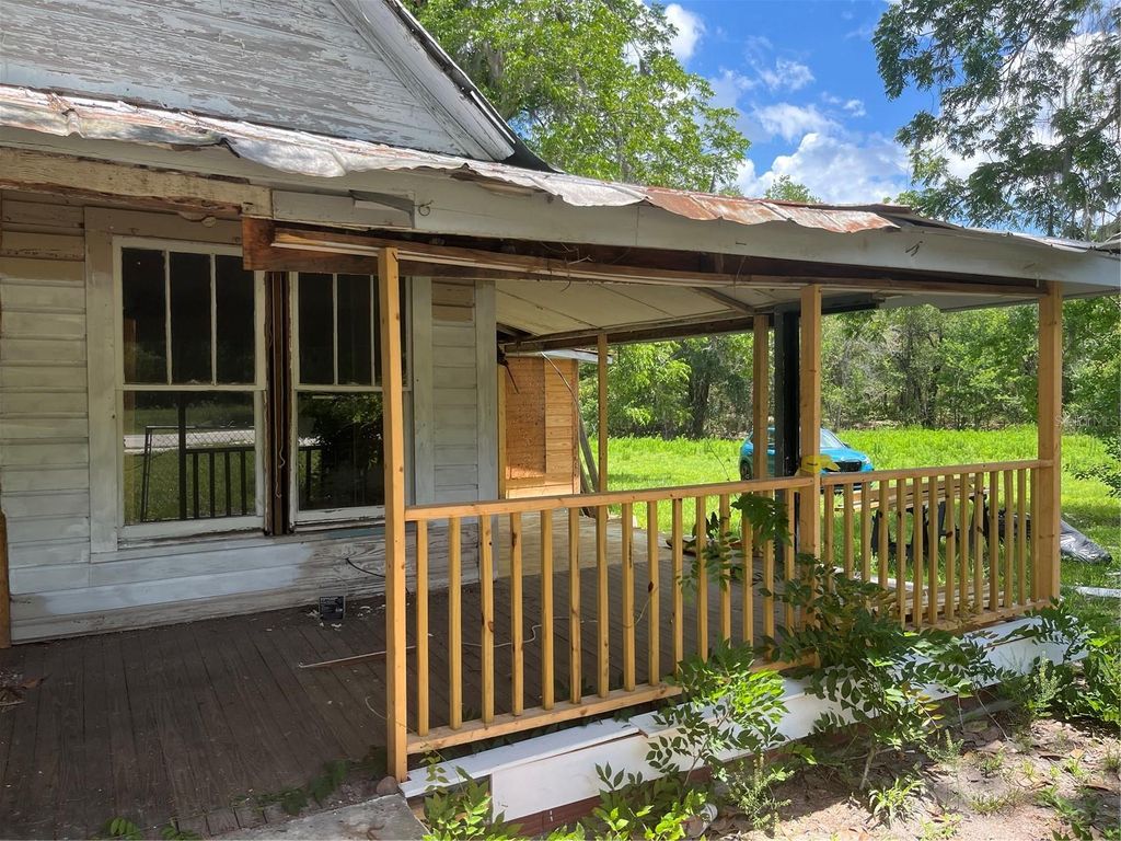 Photo of 10033 SW County Road 225, Starke, FL 32091 (MLS # P4938428)