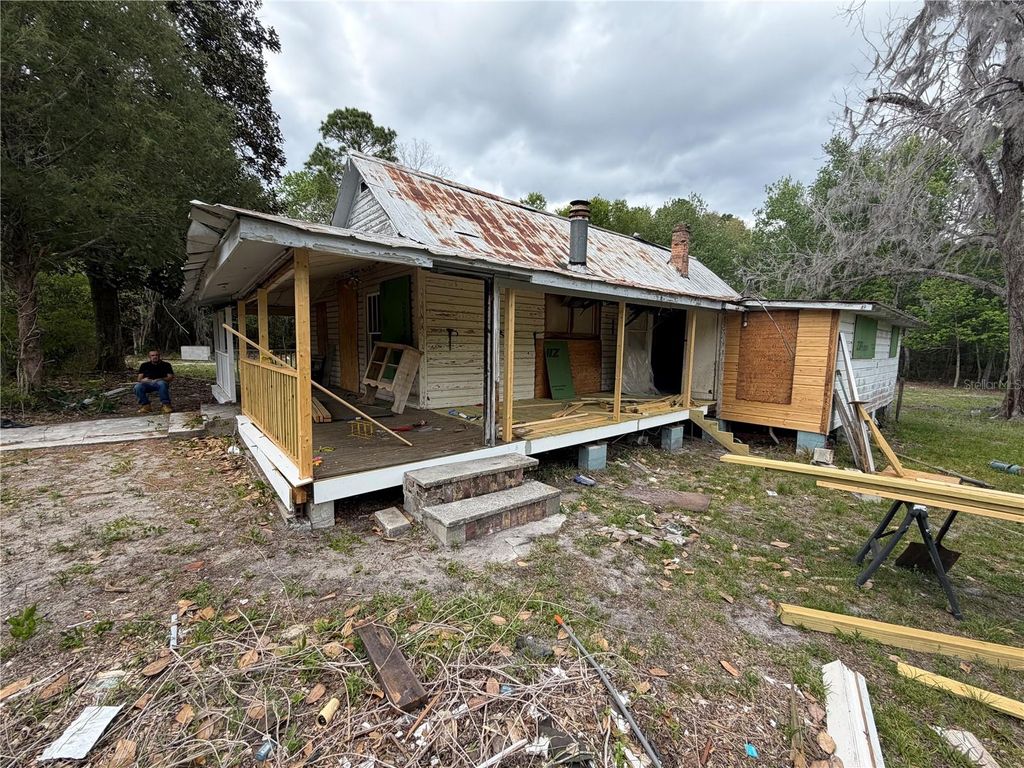 Photo of 10033 SW County Road 225, Starke, FL 32091 (MLS # P4938428)