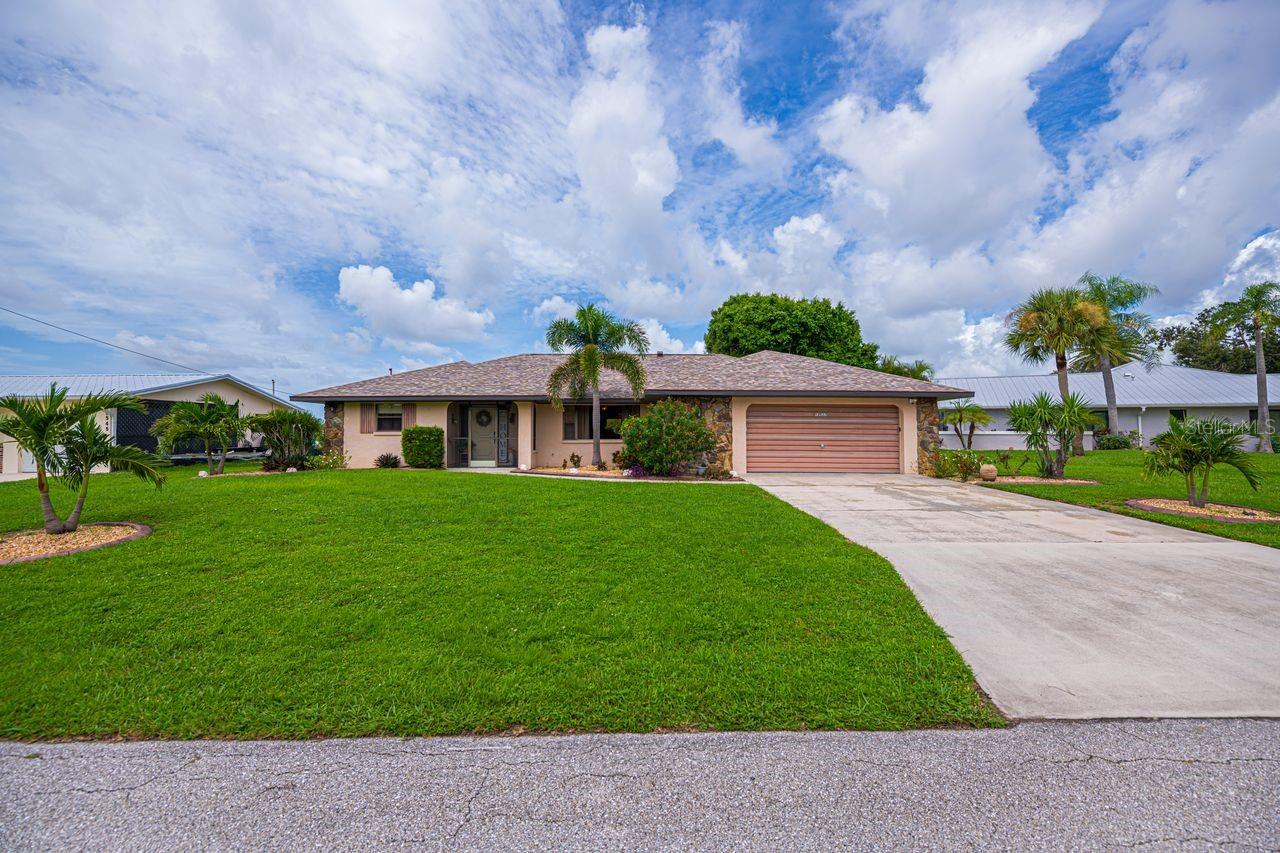 Welcome to this well-maintained pool home nestled on a large Gulf access lake, offering quick and easy access to Charlotte Harbor with only one bridge to open waters. Enjoy breathtaking western exposure—perfect for taking in Florida’s spectacular sunsets right from your own backyard. This home boasts a spacious lanai and an additional patio, ideal for outdoor living and entertaining. Inside, the open-concept layout centers around a bright and functional kitchen, creating a warm and inviting space for everyday living. A unique feature of this property is the separate attached, air-conditioned room with its own private entrance—perfect for a home office, guest suite, hobby room, or storage. Don't miss this opportunity to own a piece of paradise with direct water access and serene views!