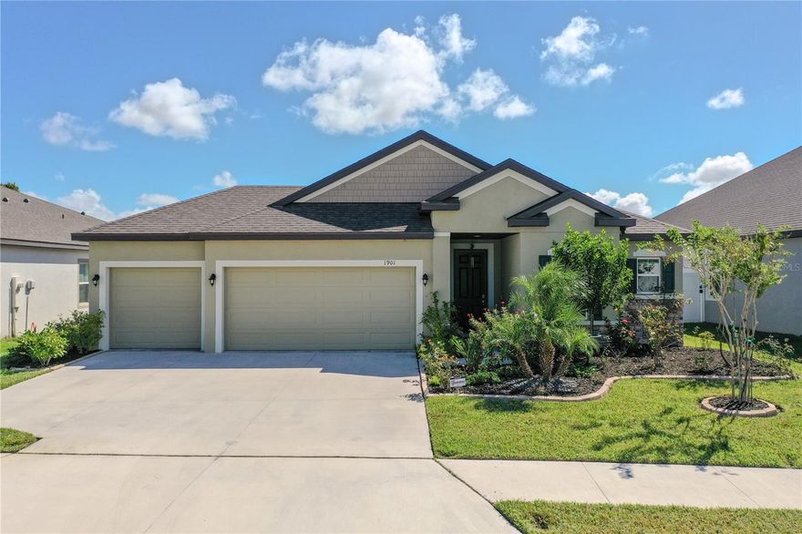 Prepare to be enchanted by this stunning three-bedroom, two-bathroom haven nestled in the coveted Villages of Glen Creek community. Built in 2023, this meticulously maintained gem offers modern elegance combined with the warmth of home. Step inside to discover a spacious open-concept layout that seamlessly blends the living, kitchen, and dining areas, perfect for entertaining or cozy family gatherings. Gleaming ceramic tile flows throughout the main living spaces, while plush carpet invites comfort in the bedrooms. The heart of this home is undoubtedly the gourmet kitchen, featuring stainless steel appliances, a huge island with ample storage, and generous seating—ideal for casual meals or lively conversations. A delightful bonus/office den, accessible through elegant glass French doors, offers versatility for work or leisure. Retreat to the primary suite, a serene escape complete with a bright en-suite bathroom designed for relaxation. Indulge in the soaking garden tub, enjoy the spacious stand-up shower, and appreciate the convenience of a single vanity with dual sinks and a dedicated vanity area. Step outside through the sliding glass doors from the living room to your fully screened-in lanai, where you can sip your morning coffee while overlooking the beautifully landscaped, fully fenced backyard. Here, you’ll find your own tropical oasis featuring fruit trees, including guava, orange, lemon, and lime—perfect for enjoying fresh flavors right from your garden! This home is not just beautiful but also smart! Equipped with Guardian Home Security, you can easily manage your home with smart features that allow you to open doors, control your garage, view your cameras and set your thermostats all at your fingertips. Situated in a great neighborhood, this residence is conveniently close to schools, shopping, and restaurants, with just a short drive to the stunning local beaches. The HOA includes cable and internet, ensuring you stay connected and entertained. Additionally, enjoy a wealth of amenities within the community, including a gated entrance, a refreshing community pool, and a lovely park for leisurely strolls or picnics. Don’t miss your chance to make this dream home your reality! Contact me today for a private showing and step into the lifestyle you’ve always envisioned!