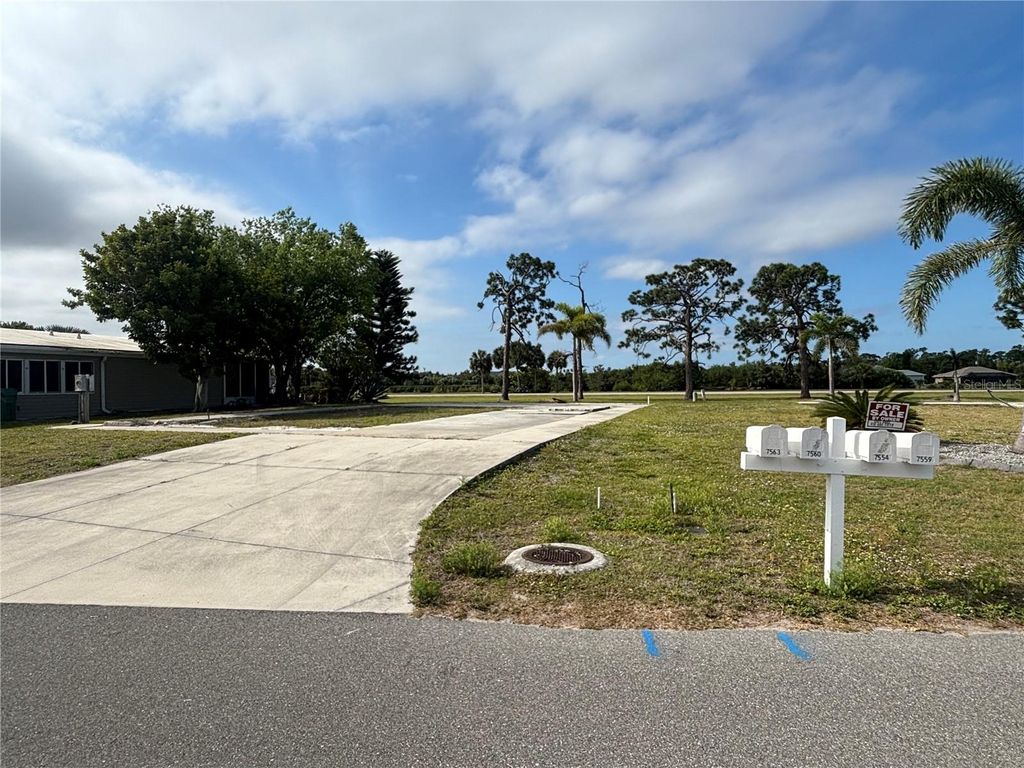 Photo of 7560 Danvers Cir, Port Charlotte, FL 33981 (MLS # C7525117)