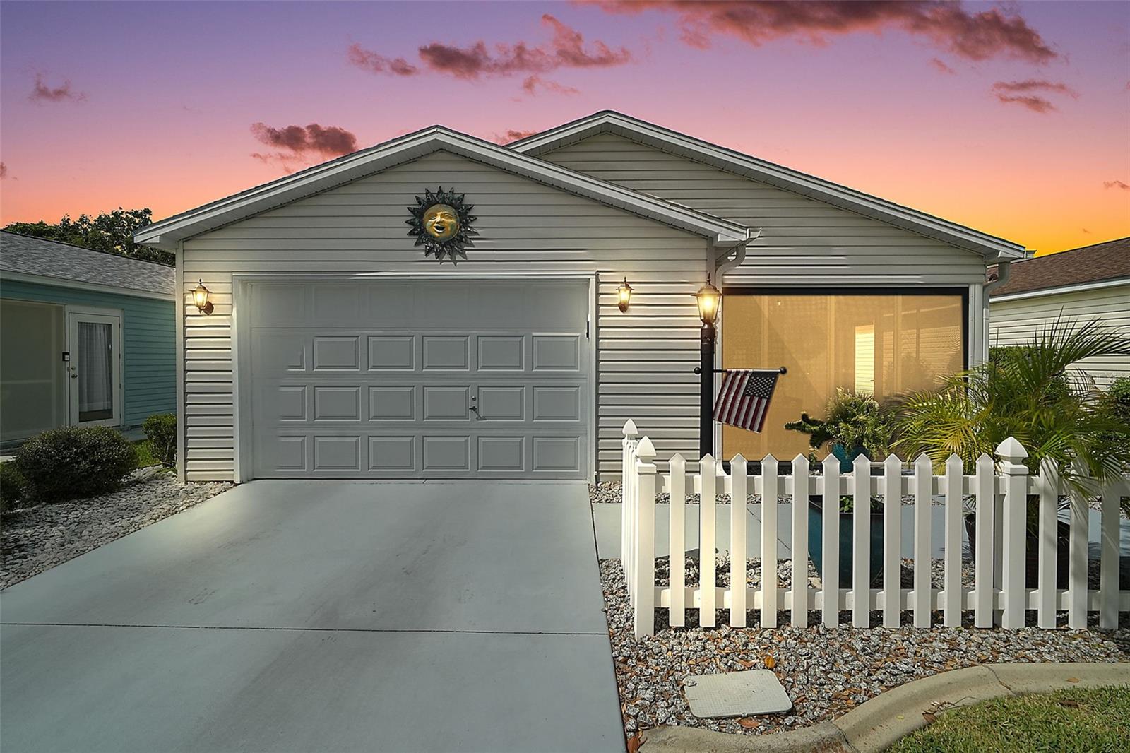 METICULOUSLY-MAINTAINED, TURNKEY 2/2 Cabot Cove Patio Villa with GLASS ENCLOSED LANAI, INTERIOR LAUNDRY ROOM, and REAR PRIVACY LANDSCAPING, CONVENIENTLY LOCATED just minutes to both Lake Sumter Landing and Spanish Springs in the charming village of Rio Ranchero! BOND PAID! A white picket fence, mature landscaping with CURBED edges, and LOW MAINTENANCE stoned planting beds welcome you into the FABULOUS ENCLOSED LANAI boasting TILE floors and FULL GLASS SLIDING PANELS. This wonderful room is the perfect spot for ENTERTAINING friends and family or simply RELAXING with your morning coffee, evening cocktail, or a good book! Step through the front door into the OPEN CONCEPT floor plan of the living, dining, and kitchen. This spacious main living area features CROWN MOLDING and RICH WOOD LAMINATE flooring. Sliding doors off of the dining area open to an outside patio area and yard with PRIVACY landscaping - ideal for ENJOYING the beautiful Florida weather! Back inside, the AMAZING kitchen boasts a TILE floor, WHITE cabinetry, GRANITE countertops, STAINLESS appliances, and EAT-IN breakfast bar. The primary bedroom features a WALK-IN closet and an en-suite bathroom with TILE floors, WOOD cabinetry with GRANITE top, and WALK-IN TILED shower. Bedroom two offers a built-in closet. The second bathroom has WHITE cabinetry with GRANITE top, a TILED tub and shower combination, TILE floors, and a hallway LINEN closet. An INTERIOR LAUNDRY ROOM is CONVENIENTLY located just off of the kitchen and boasts TILE floors, shelving, and a LARGE PANTRY/STORAGE closet. It leads you into the 18’x22’ one and half car garage featuring EPOXIED floors and plenty of space for a car and a golf car! UPGRADES INCLUDE: NEW Pella Windows and Patio Doors (4/2020); NEW HVAC (6/2020); NEW Primary Bedroom Shower (7/2022); Enclosed Front Porch (10/2023); Solar Panels Installed (6/2024); HVAC UV System and Duct Sealant Installed (2/2025). DON’T MISS THE OPPORTUNITY to make this LOVELY TURNKEY home your own! The Village of Rio Ranchero is just minutes to both Lake Sumter Landing and Spanish Springs; close to Tierra Del Sol and Glenview Country Clubs and Championship Golf Course; Hacienda Regional Recreation Center; executive golf, recreation centers, pools, pickle ball, shopping, restaurants, and the Villages Regional Hospital. PLEASE WATCH OUR WALKTHROUGH VIDEO OF THIS WONDERFUL TURNKEY VILLA, and call today to schedule your Private Showing or Virtual Tour!