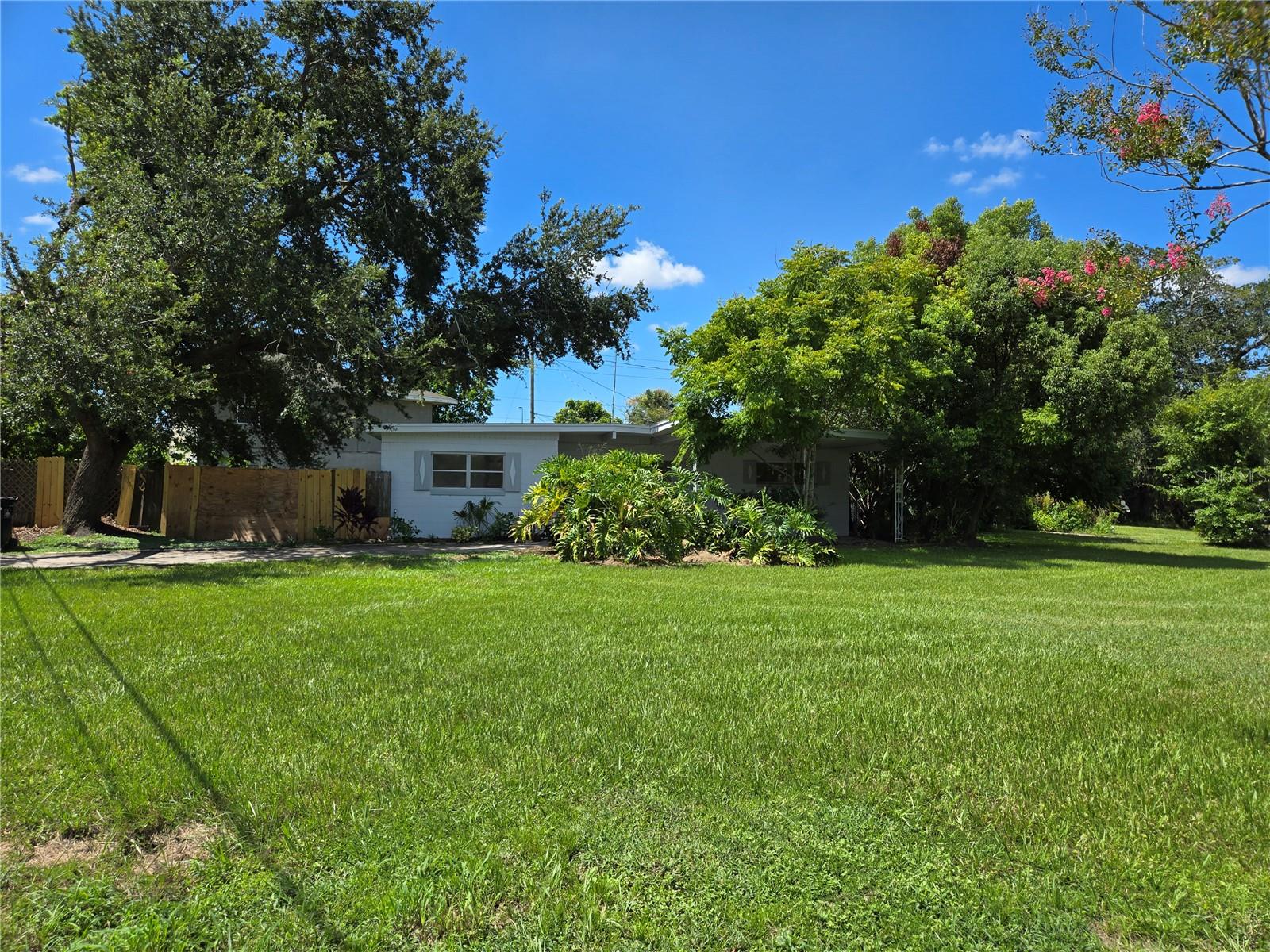 This 3 bedroom, 2 bathroom home with 1,259 sq. ft. is an investor’s or first-time buyer’s dream! Featuring tile flooring throughout and a split-bedroom floor plan, the master suite offers a standalone shower, new vanity, and new medicine cabinet. Freshly painted ceilings, walls, doors, and trim give the home a bright, updated feel. The long galley kitchen overlooks the expansive backyard, while the oversized front yard offers beautiful privacy landscaping. The guest bathroom includes a bathtub with tile surround. A carport provides parking. The exterior also features a brand new coat of fresh paint, enhancing the home’s curb appeal. Easy to show, see it today!