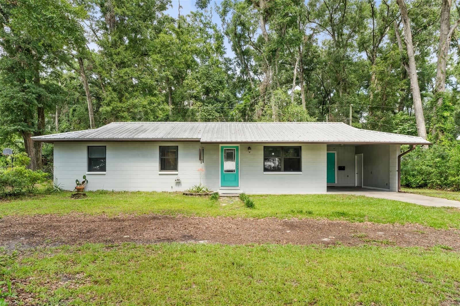 One or more photo(s) has been virtually staged. Welcome to 17142 NW 240th Terrace, a beautifully updated 4-bedroom, 2.5-bathroom home located in the heart of High Springs. This spacious residence offers a comfortable layout along with recent major updates, including a 10-year-old metal roof and HVAC system, plus a 2-year-old water heater for added peace of mind. Inside, the open floor plan offers flexibility for a variety of lifestyles. The living and dining areas flow into a well-appointed kitchen, and all four bedrooms have ample space and natural light. The primary suite features its own private bath for added convenience. Located in a quiet, established neighborhood just minutes from downtown High Springs, this property also has easy access to local springs, parks, and Gainesville. With its updates and low-maintenance features, this home is ready for its next owner. Schedule your showing today!