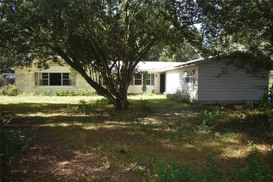 Major potential! This property on just under 4 acres in Zephyrhills offers tremendous potential for renovation or redevelopment. Features include a large detached garage with versatile space for workshops, storage, or hobbies. With ample land, there’s plenty of room for outdoor projects, gardening, or expansion. Don’t miss this opportunity to transform this property into a dream home or income-producing investment.