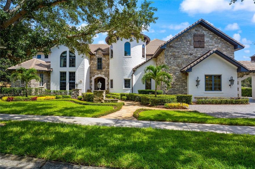 This Custom French Chateau is a one-of-a-kind dream home, built using the highest quality materials, finishes and extraordinary craftsmanship throughout. This home is situated on a private corner lot on the Golden Bear Club in Keene's Pointe with 270 degrees of amazing Golf & Water Views. Boasting over 8000sf in living area, the bottom floor has a Master Suite fit for a King - complete with fireplace, two story walk through closet, washer/dryer, Miele coffee bar & refrigerator, jetted tub, walk-thru shower and Sauna. There are 5 additional bedrooms upstairs. The gourmet kitchen has a gorgeous brick-arched ceiling, custom cabinetry, beautiful granite, huge walk-in Pantry, and top of the line Viking/Miele appliances. Off the kitchen, there is a large wine cellar & tasting room. The Great Room has an aged wood ceiling, custom entertainment center & fireplace. There is also a stunning two-story Mahogany Library & Office with leather ceiling & ornate woodwork. Upstairs includes a Billiards Room with a vintage imported European stained glass antique Bar, Copper Ceiling and Home Theater with tiered seating, rumble seats and automated A/V system. Complete safety system including a safe room, fire suppression & lighting rods. Resort-Style, free-flowing pool & spa with incredible golf and water views. Summer Kitchen, stone fireplace and extensive outdoor woodwork and lighting make this the perfect entertaining home. Recently added a 350sf Custom Home Gym.